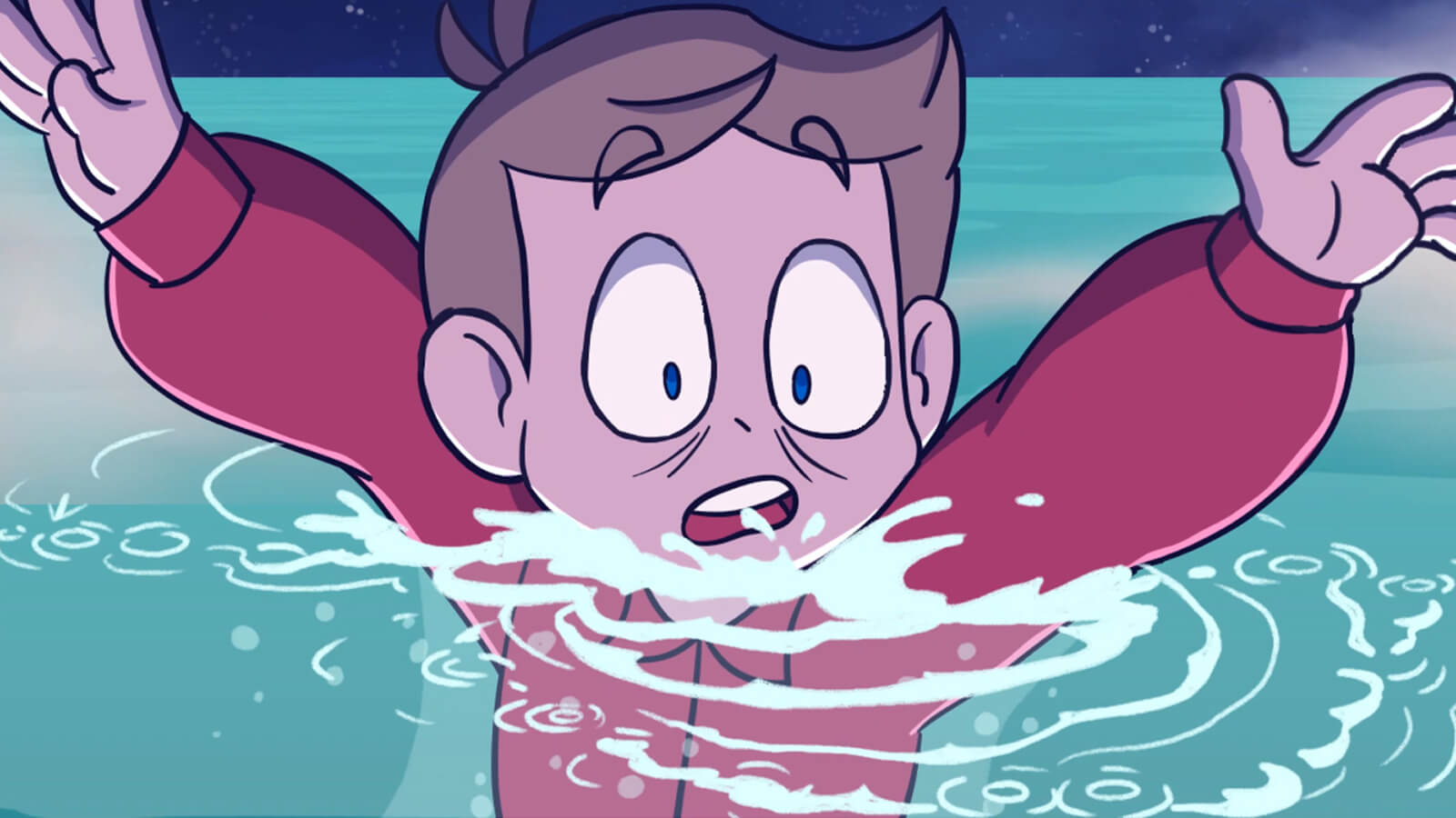 A startled boy sinks beneath the surface of the ocean.