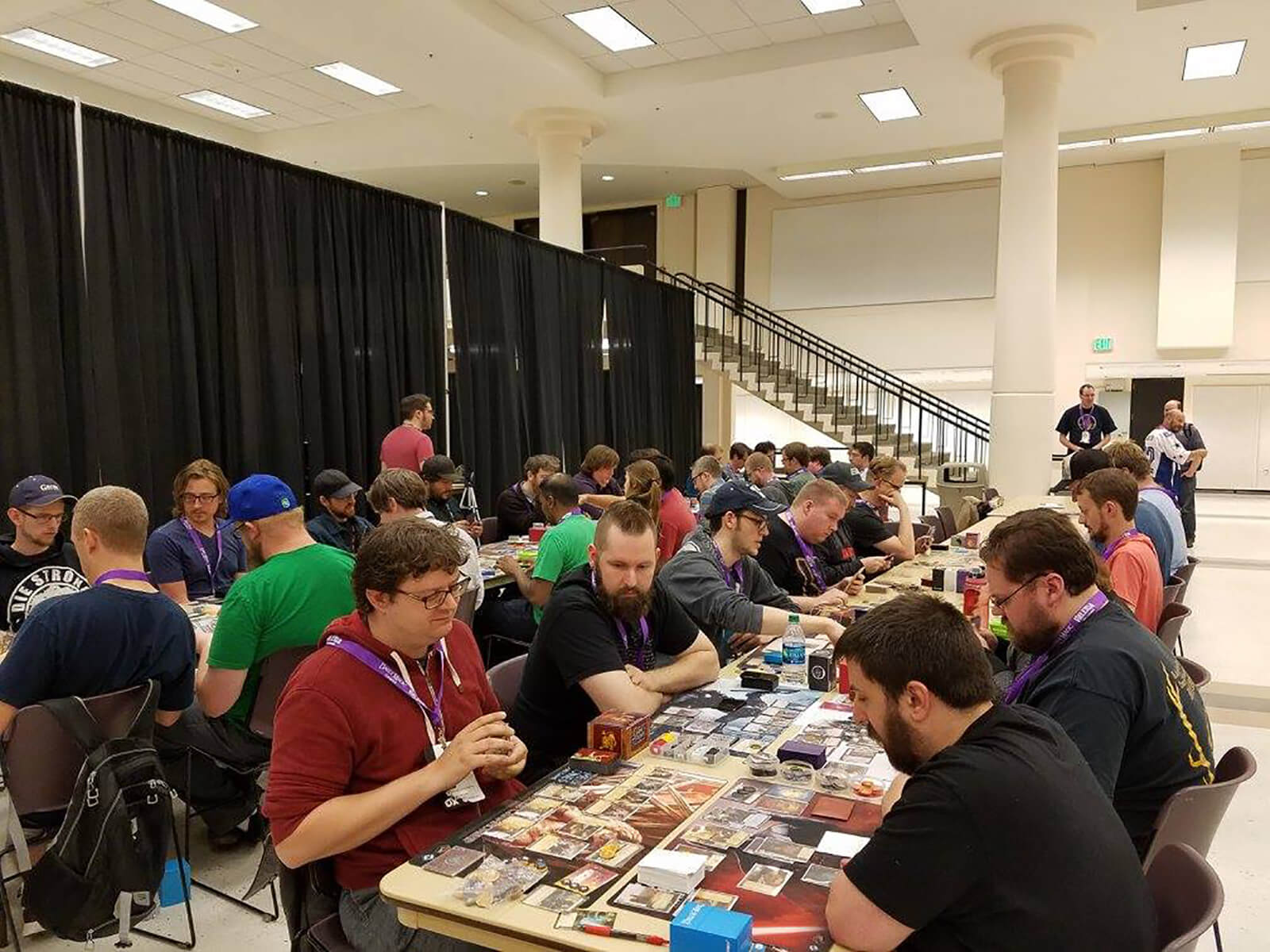 Picture from previous Evergreen Tabletop Expo featuring attendees playing board games
