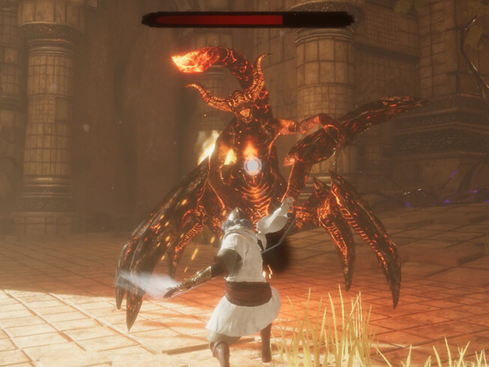 A screenshot from DigiPen student game Metamorphos depicting the hero confronting a large fiery scorpion boss in a stone temple. 