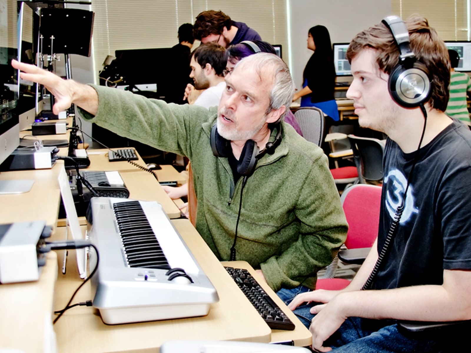 DigiPen music professor Lawrence Schwedler working with a DigiPen student in the new sound lab