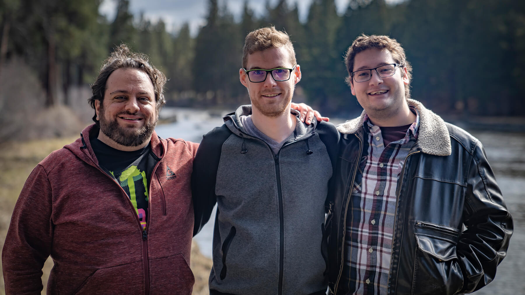 DigiPen alumni Geoffrey Hammon, Sawyer Paradise, and Jacob Fieth pose in the Bend, Oregon wilderness.