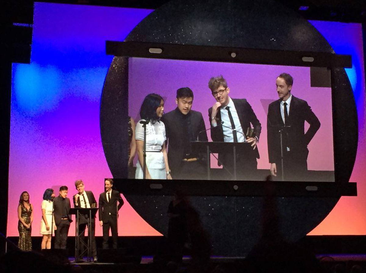 DigiPen alumni Kevin Dart and Chris Turnham on stage accepting an Annie award