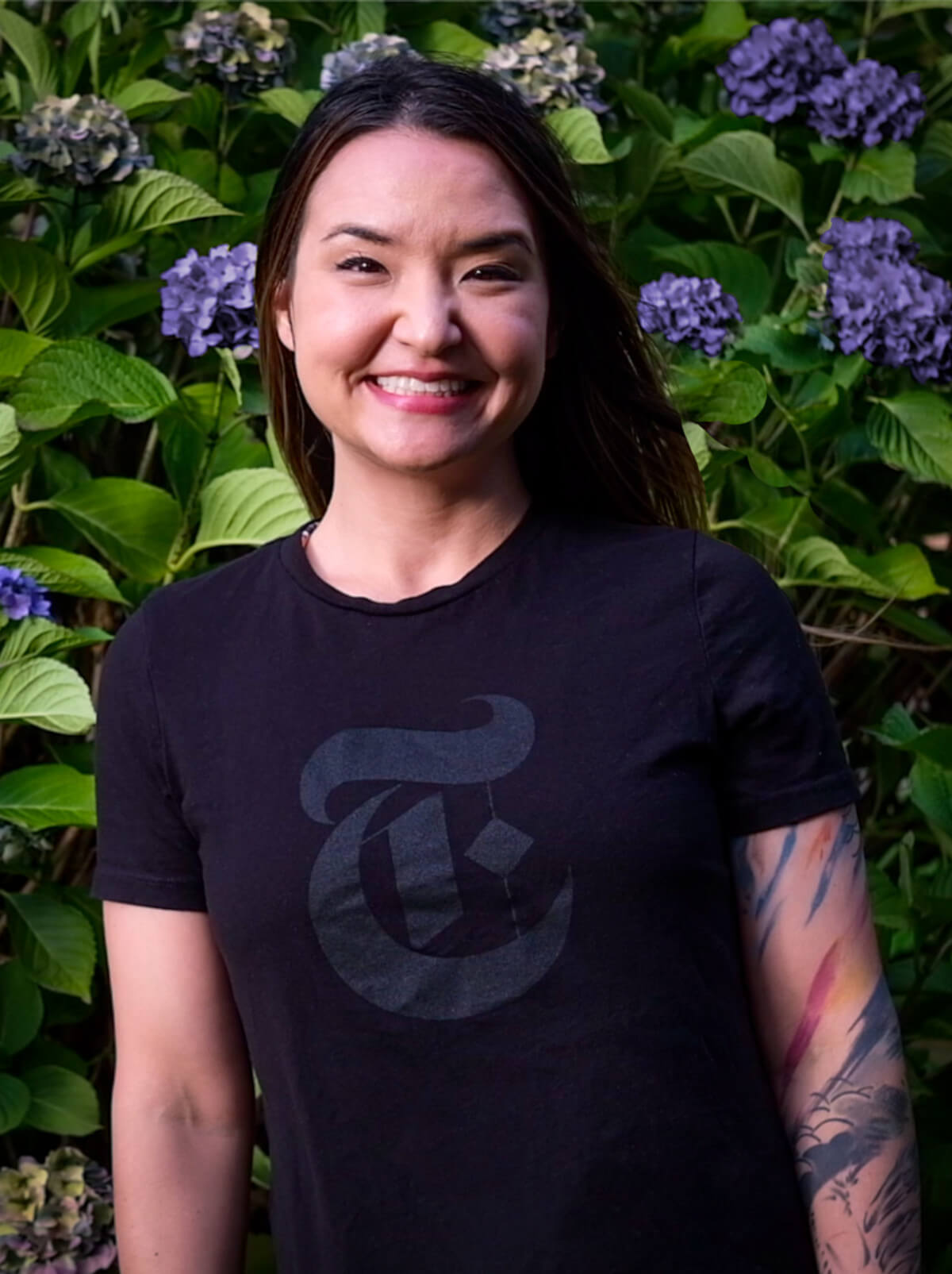 DigiPen graduate Romina Barrett wearing a New York Times logo t-shirt.