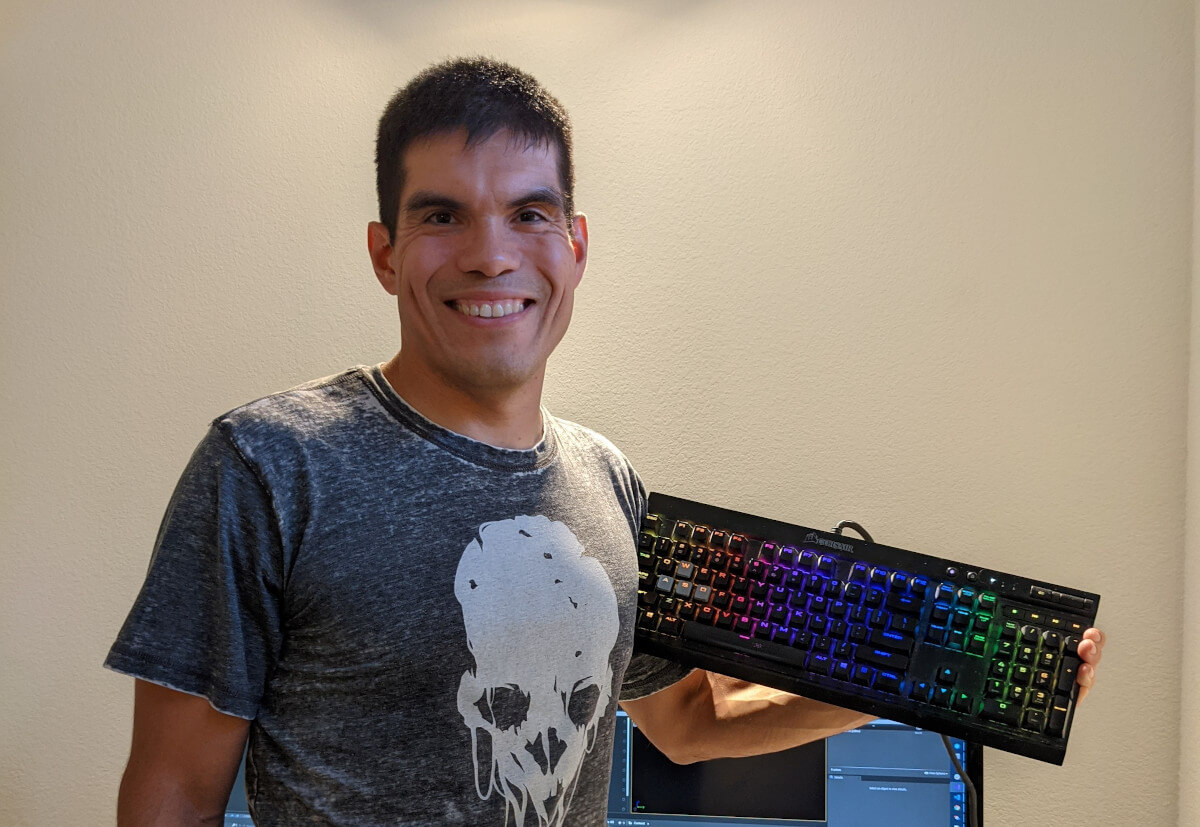 Jonathan Hurtado poses with multicolor keyboard.