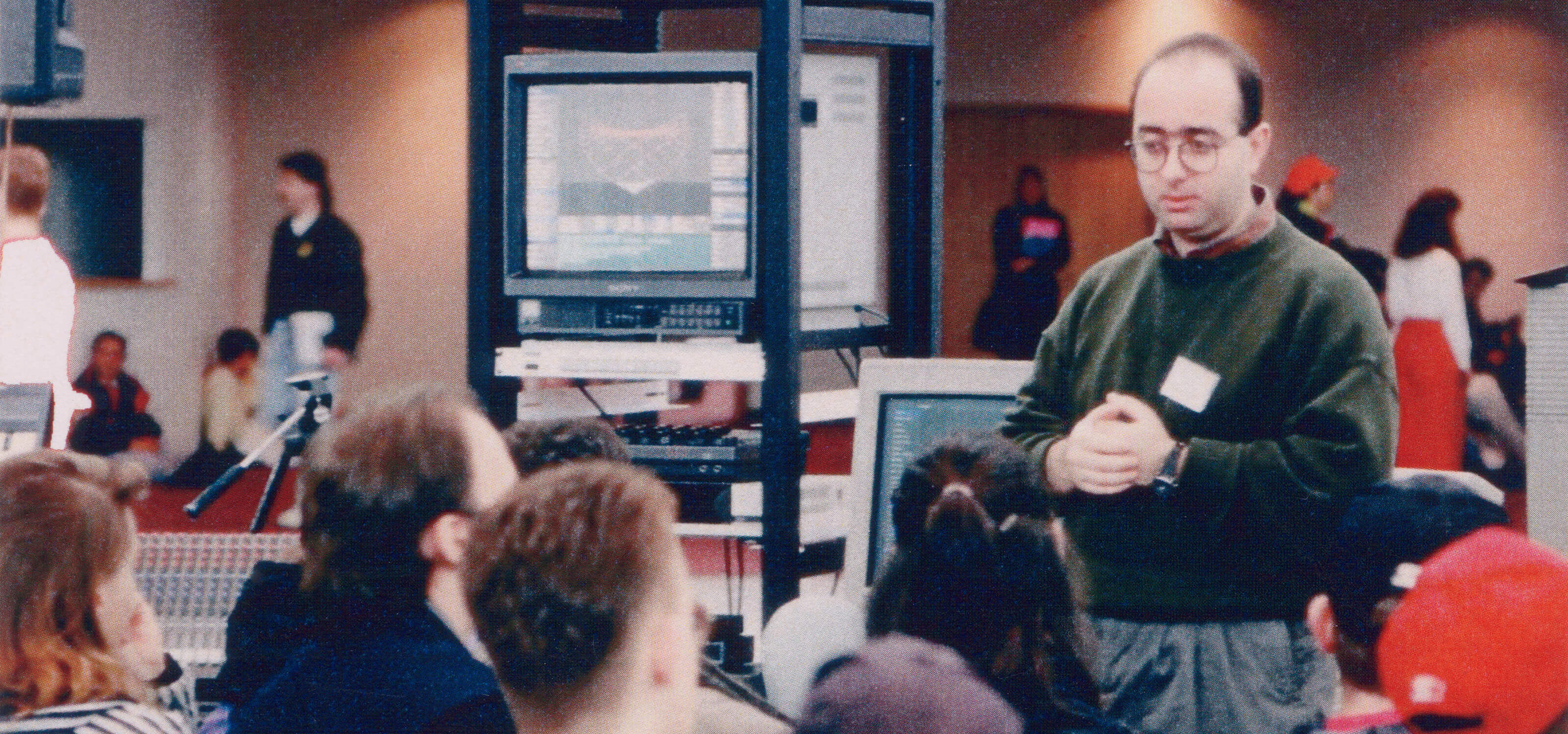 DigiPen founder and president Claude Comair speaks at a convention in 1989