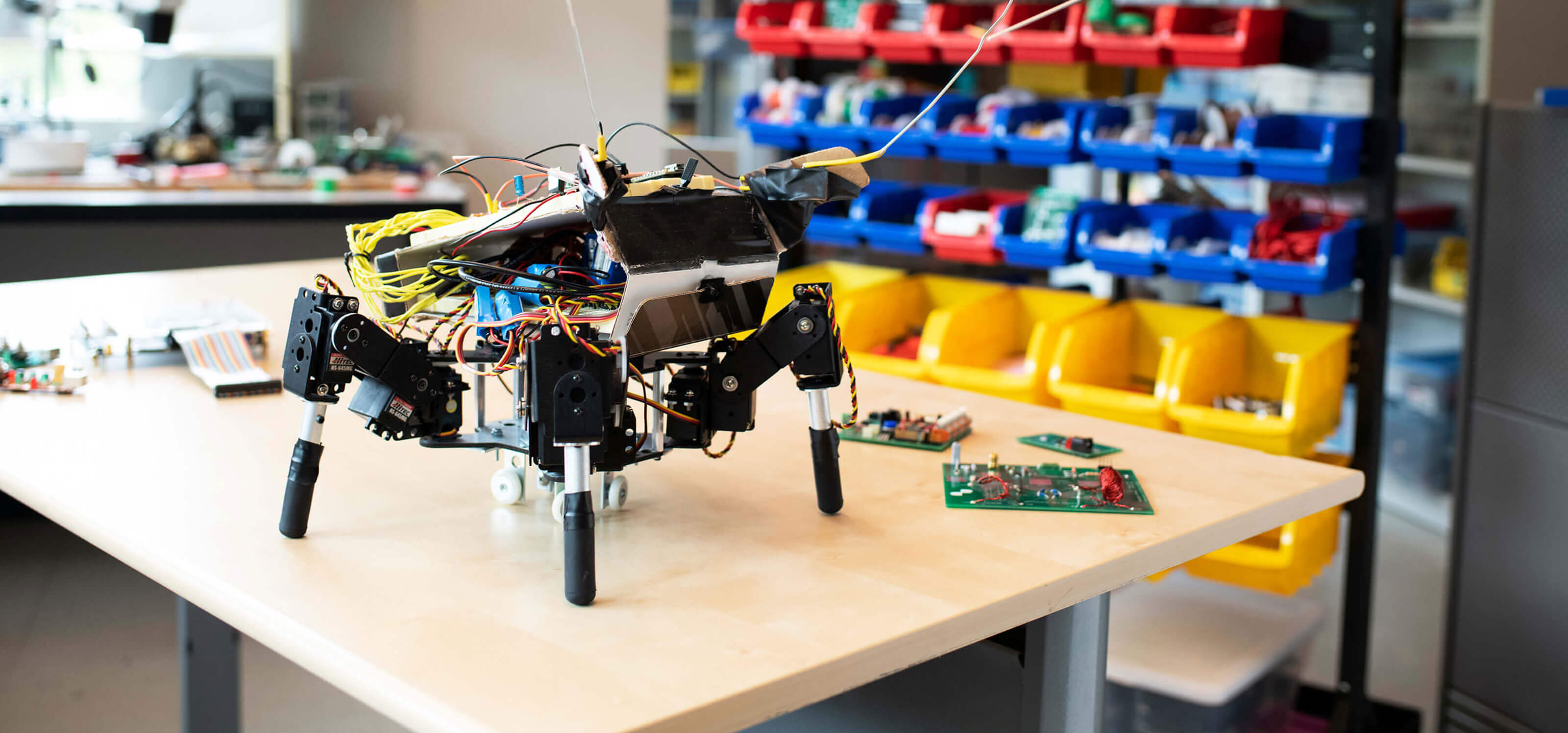 A robot sits on a table in the DigiPen computer engineering lab