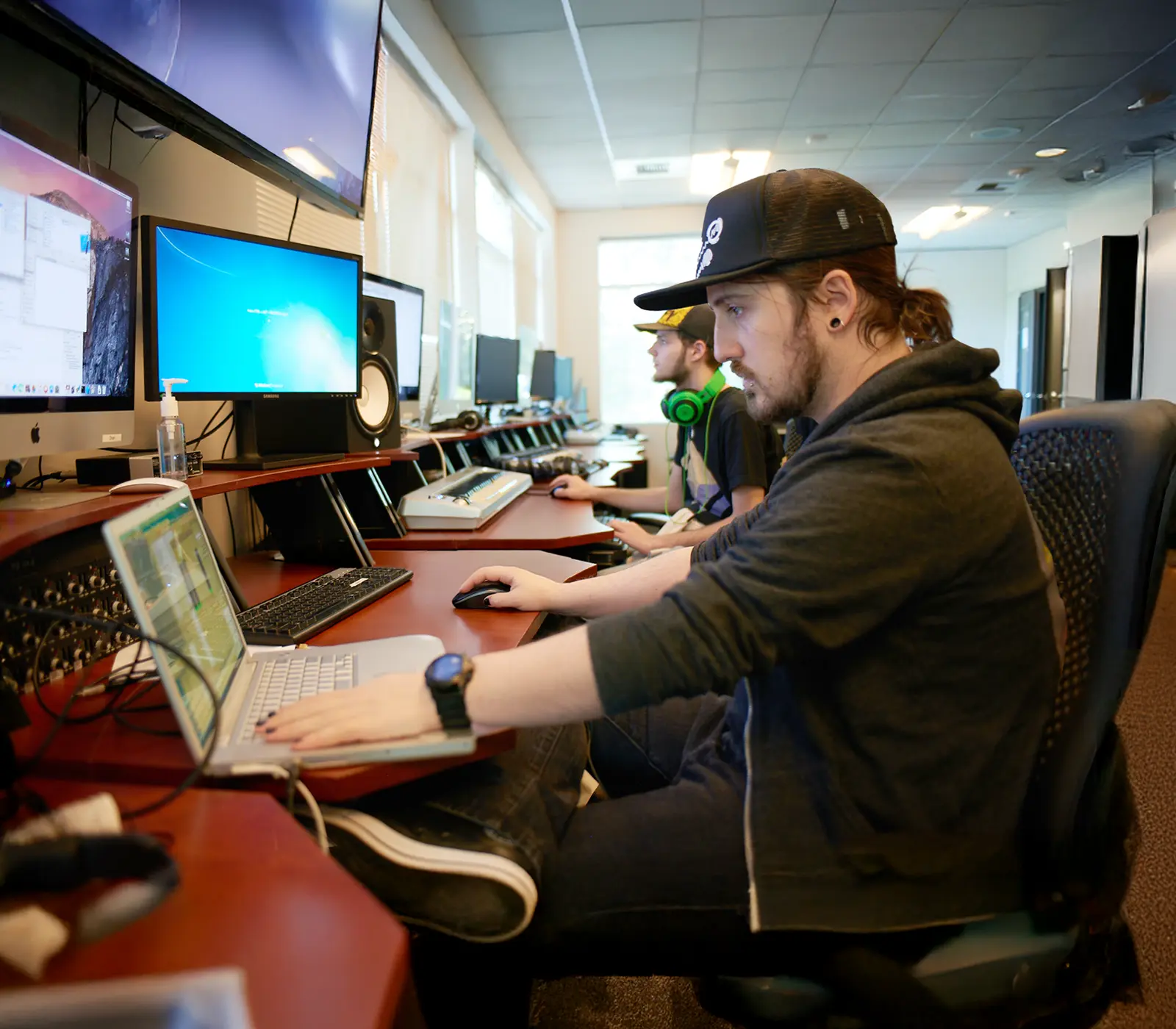 Students at workstations in DigiPen's music lab.