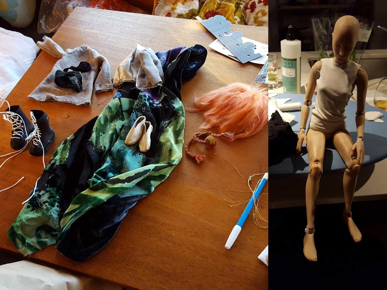 Handsewn doll clothing and shoes on a desk, next to a doll wearing a handsewn tank top.