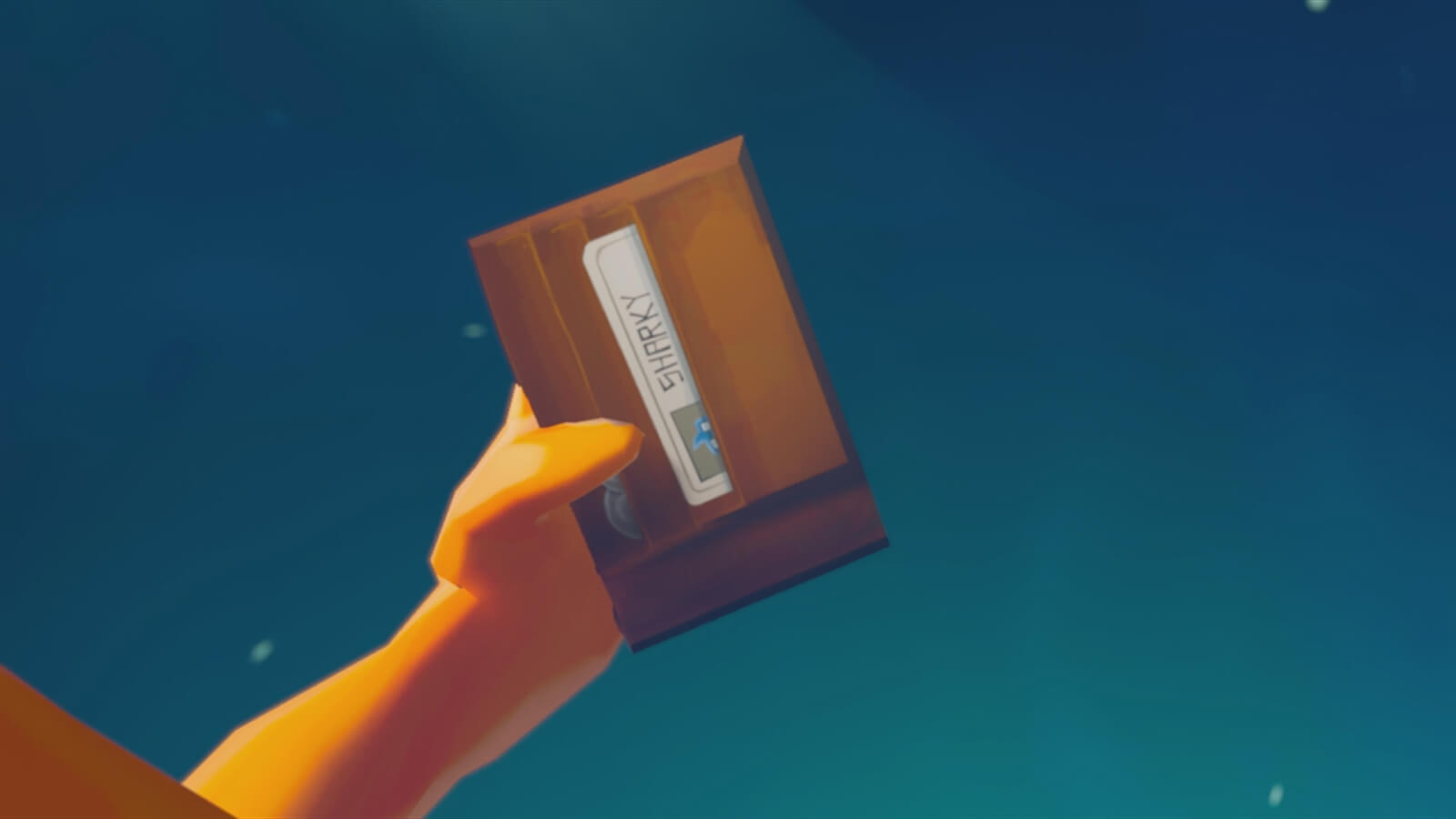 An orange hand holds out a brown wallet. An ID card with the name "Sharky" can be seen inside.