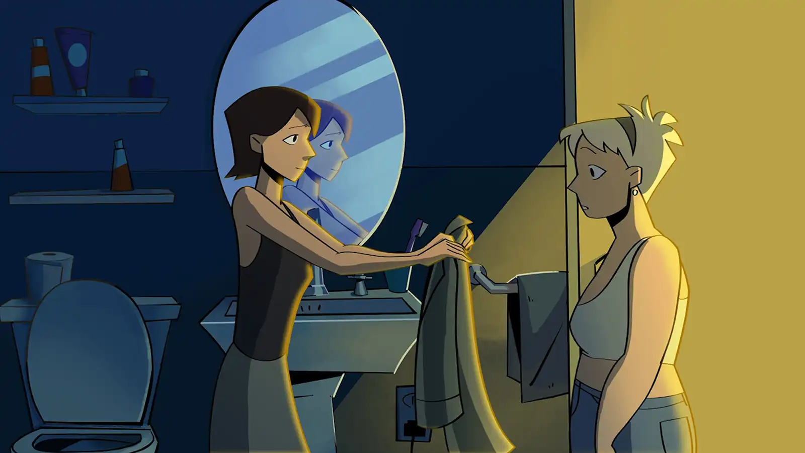 A woman helps another choose what clothing to wear.