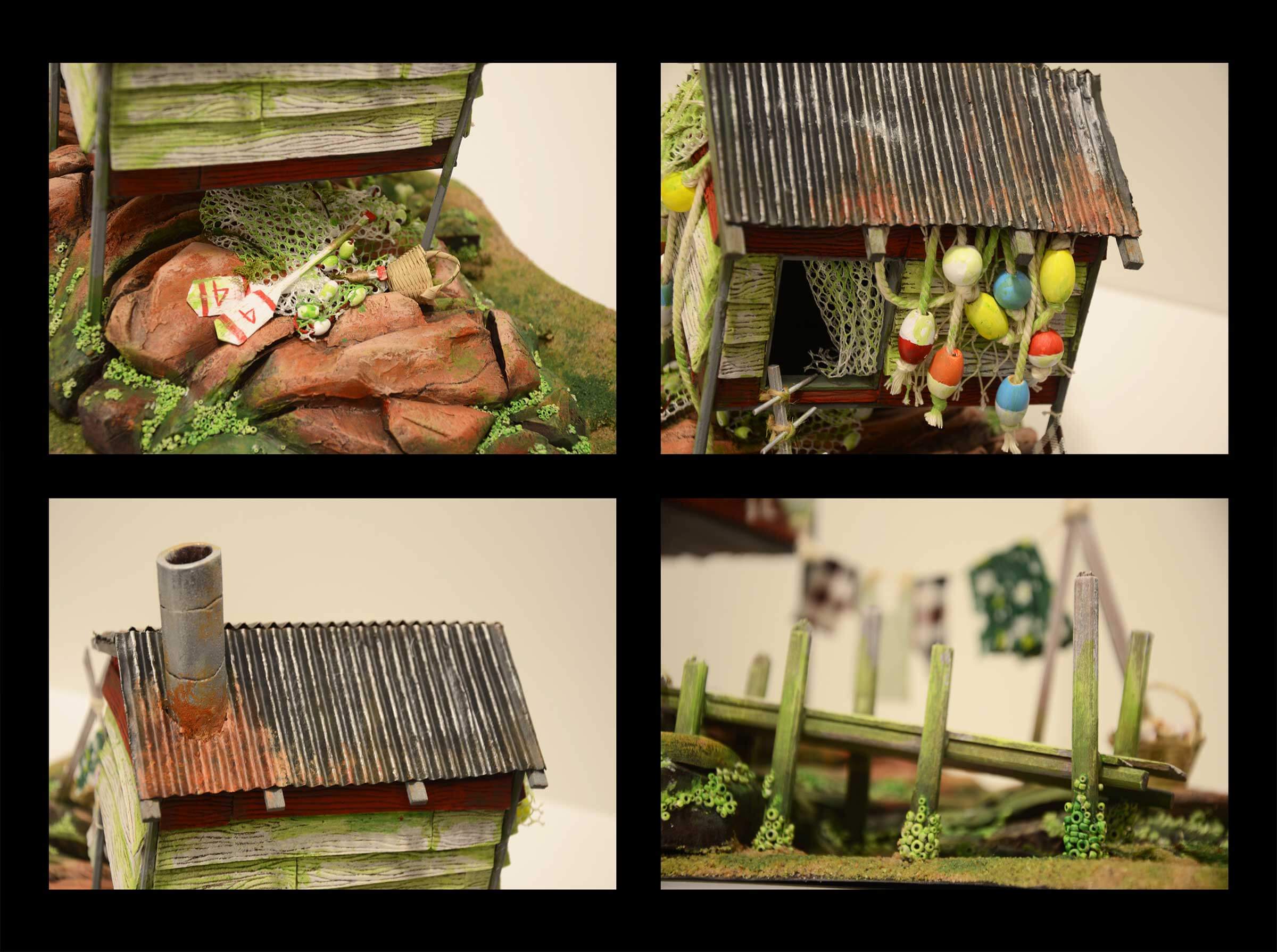 A model of a wooden shack in a swampy environment.