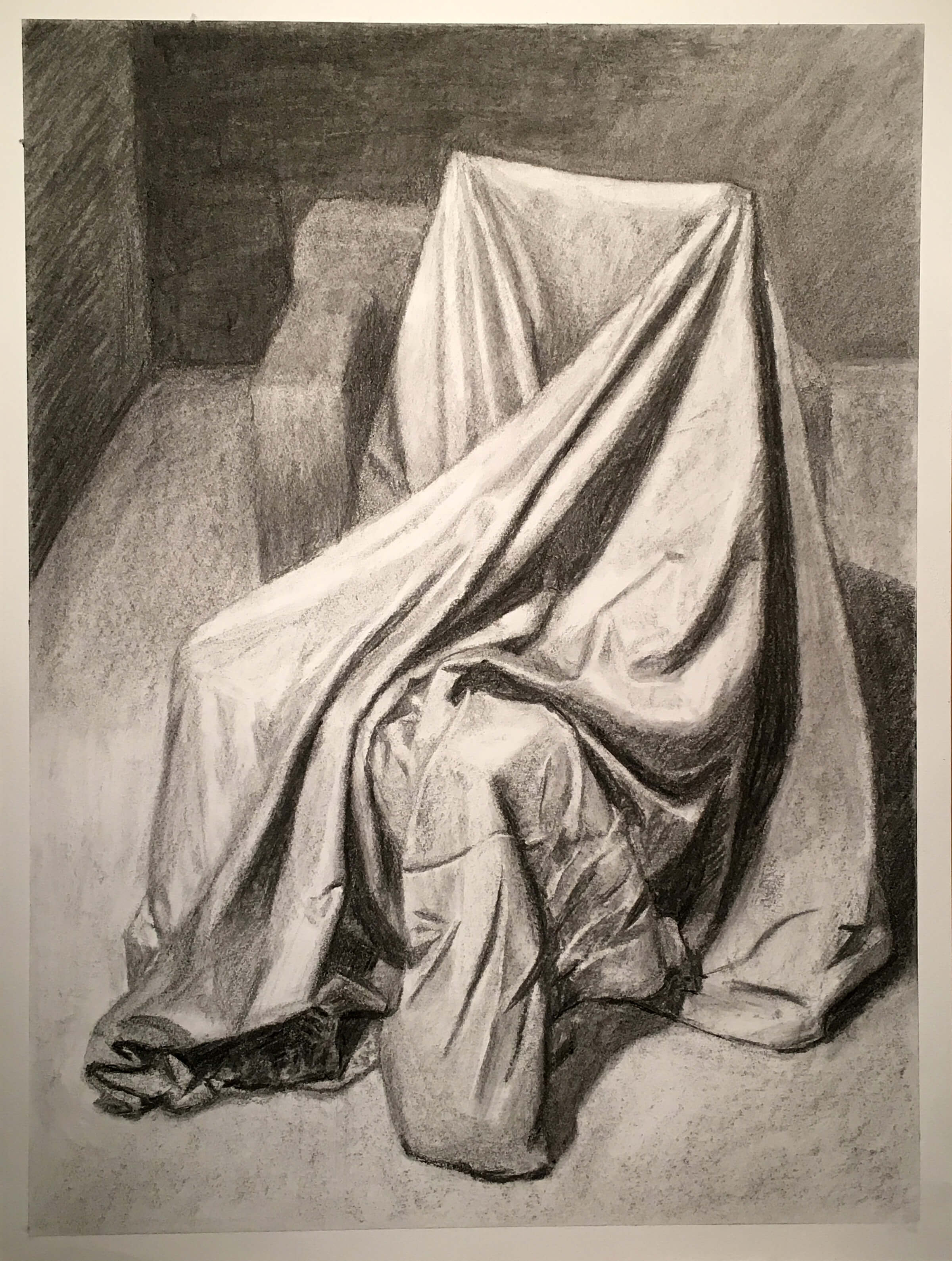 still-life drawing of a chair draped in a sheet
