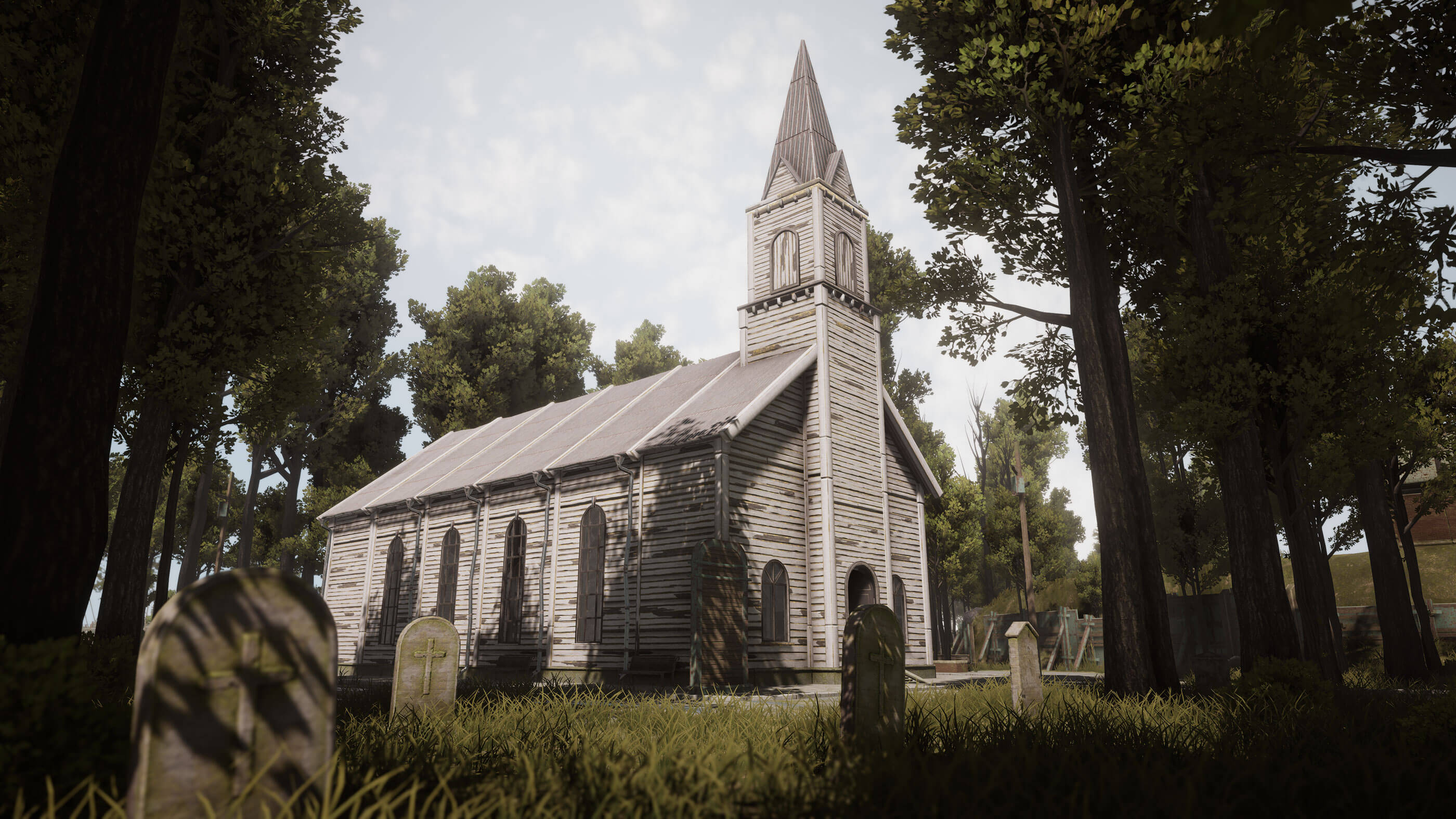 Exterior of an old church with a cemetery.