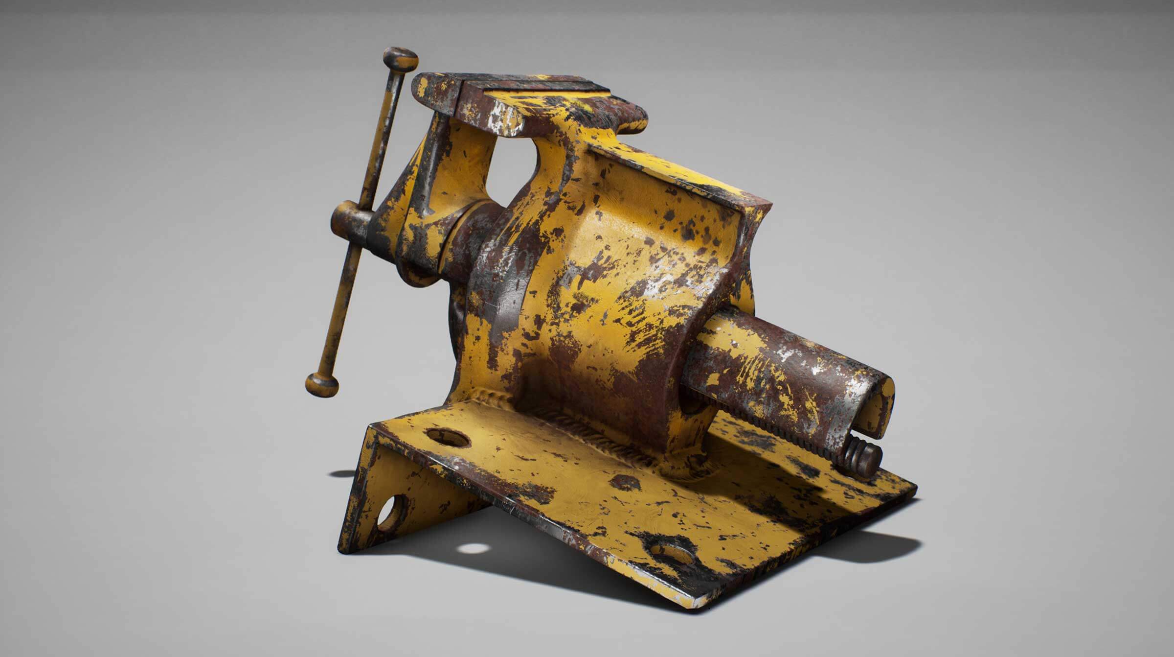 Rusted machine tool with yellow paint chipped off.