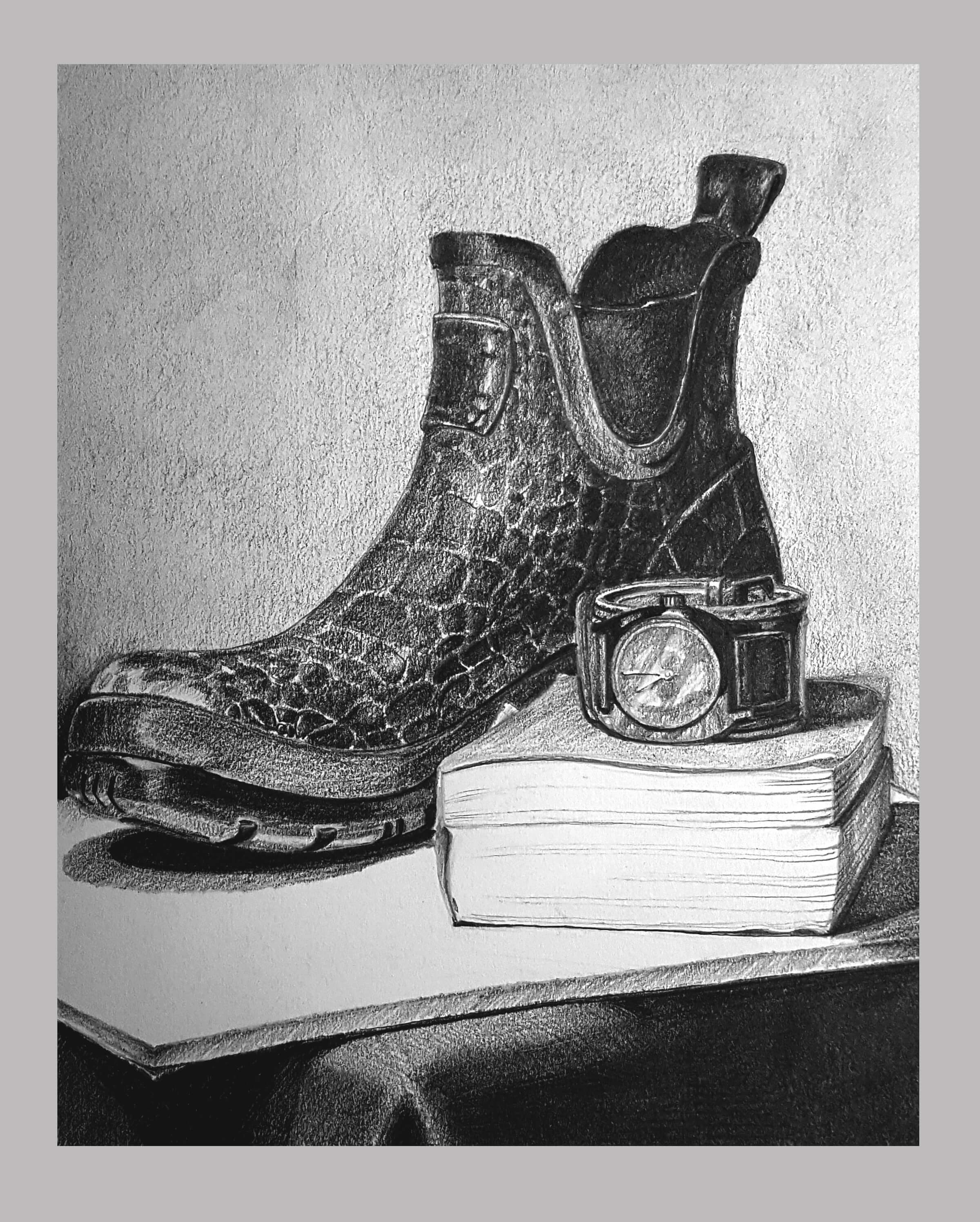 still-life drawing of a boot, wrist watch, and book