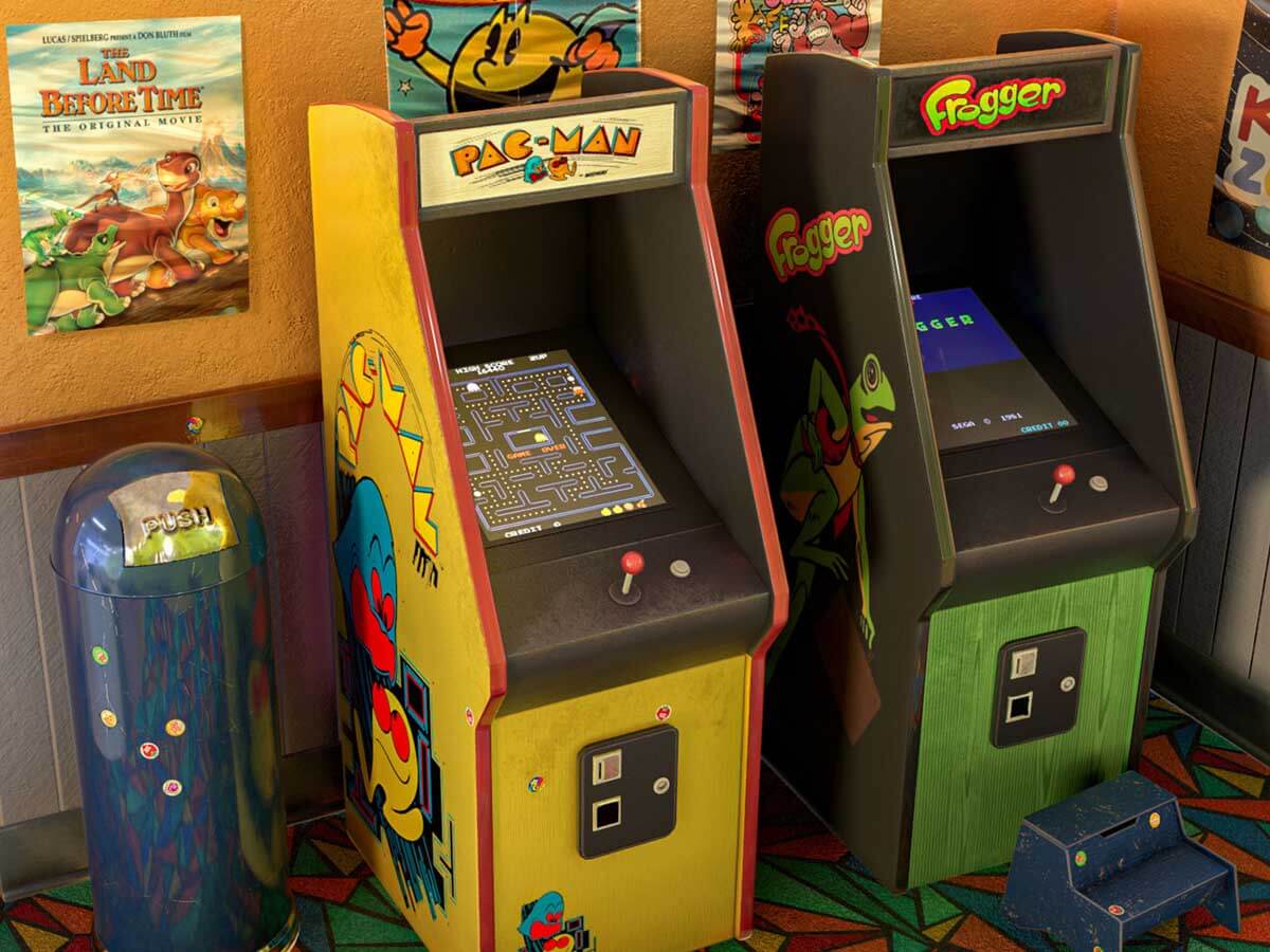 An arcade room containing Pac-Man and Frogger arcade machines.