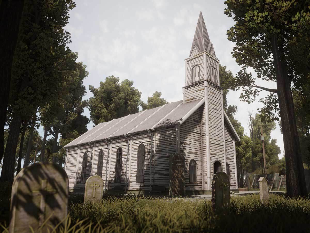 Exterior of an old church with a cemetery.