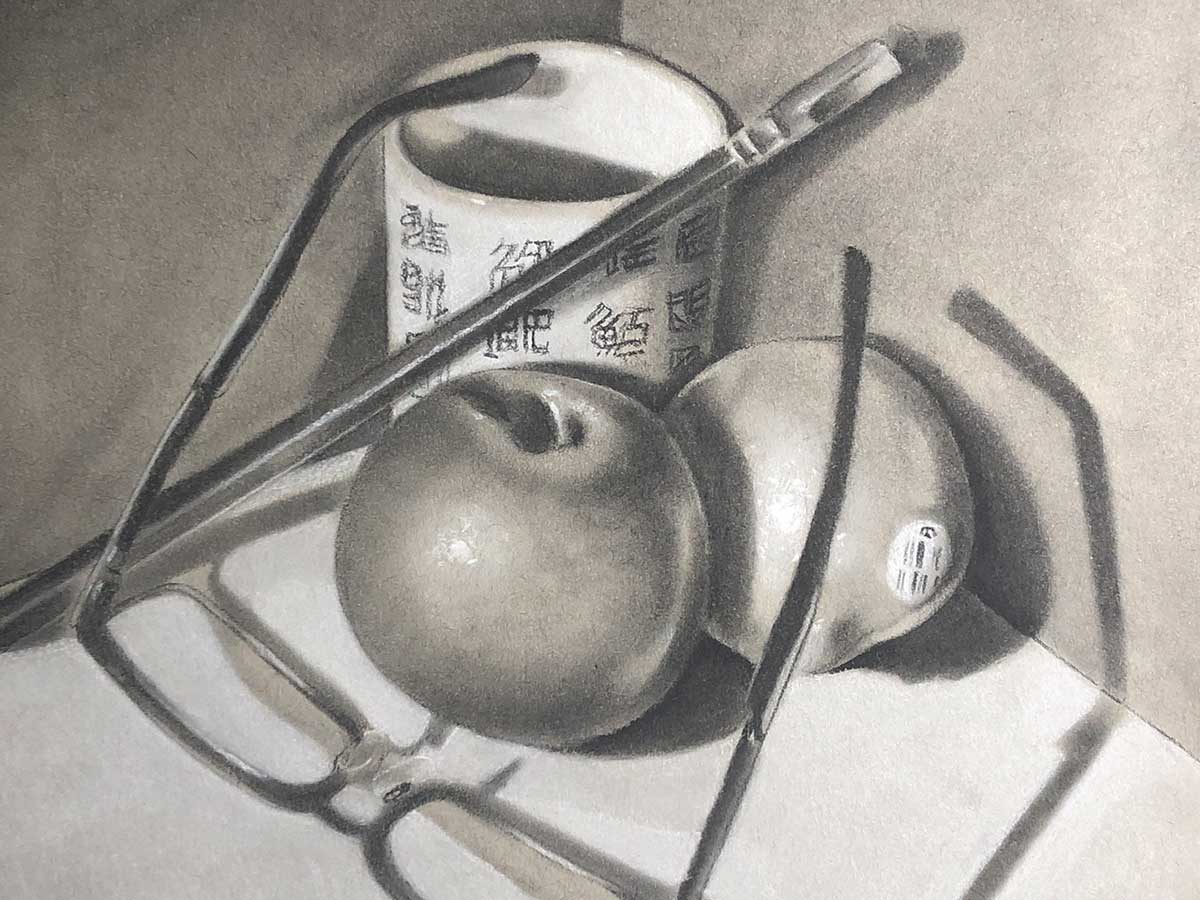 Objects including fruit, a brush, a pair of glasses, and a mug.