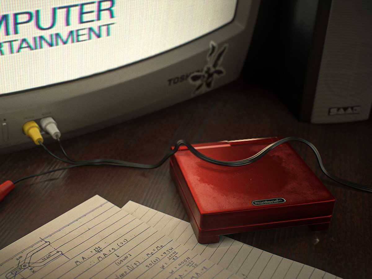 A Nintendo Gameboy next to a box television on a desk.