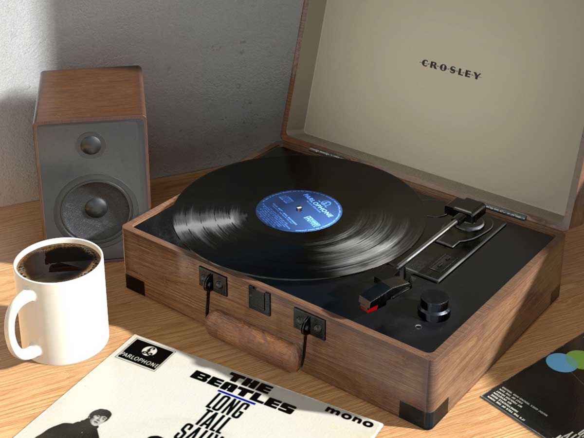 Record player with record albums on the desk and wall.