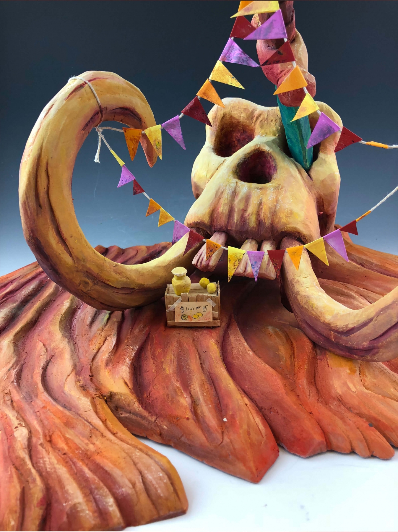 Mammoth skull draped with party flags