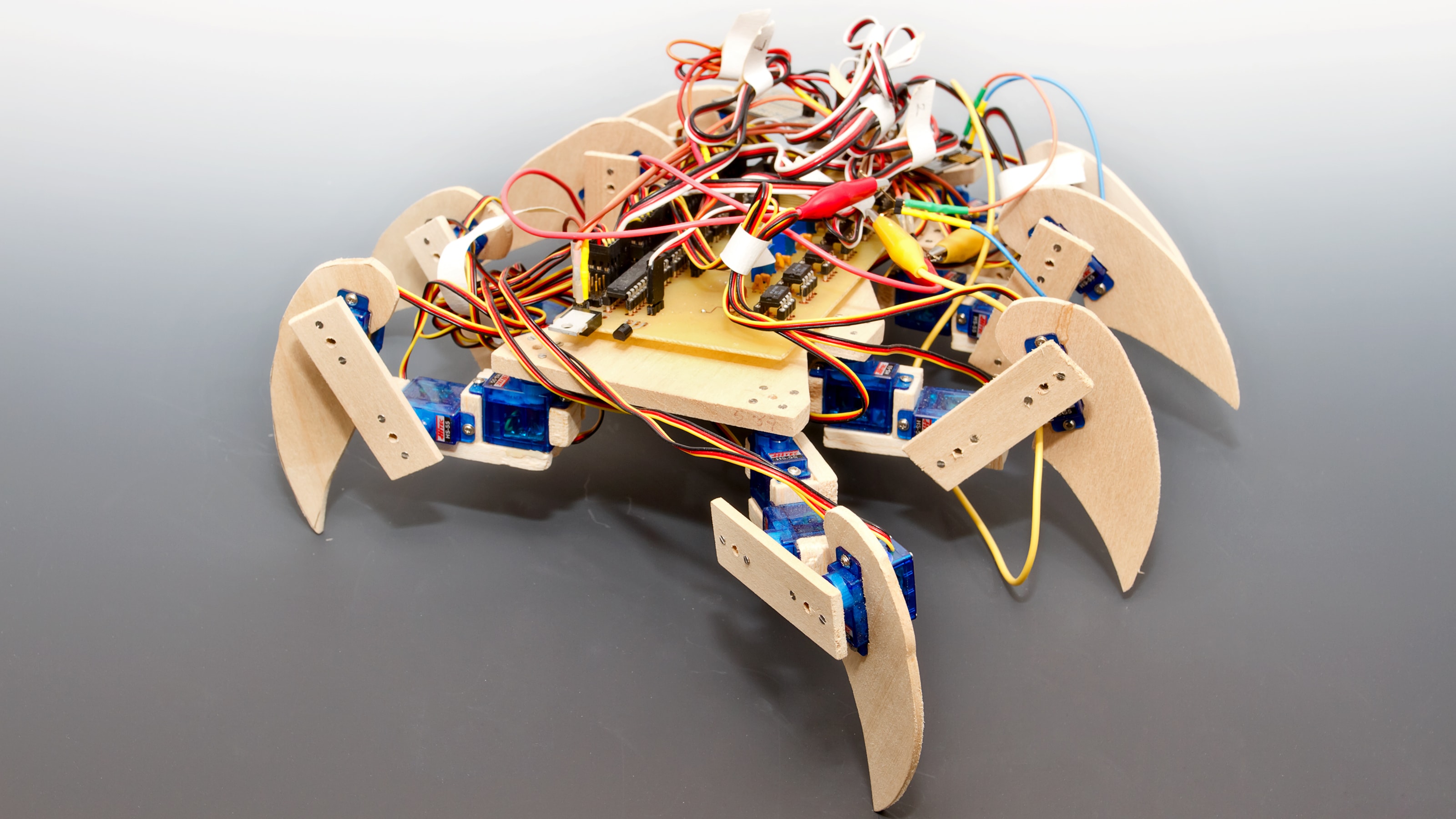 An eight-legged scorpion-like robot with exposed circuits.