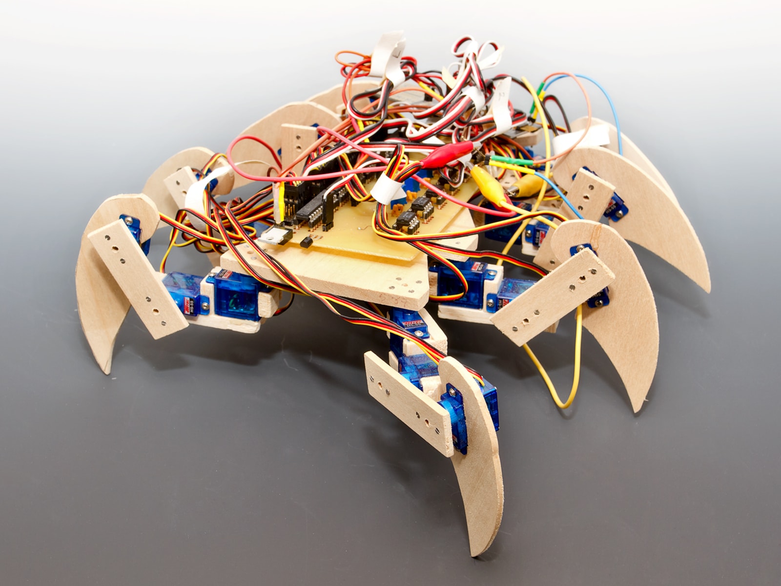 An eight-legged scorpion-like robot with exposed circuits.