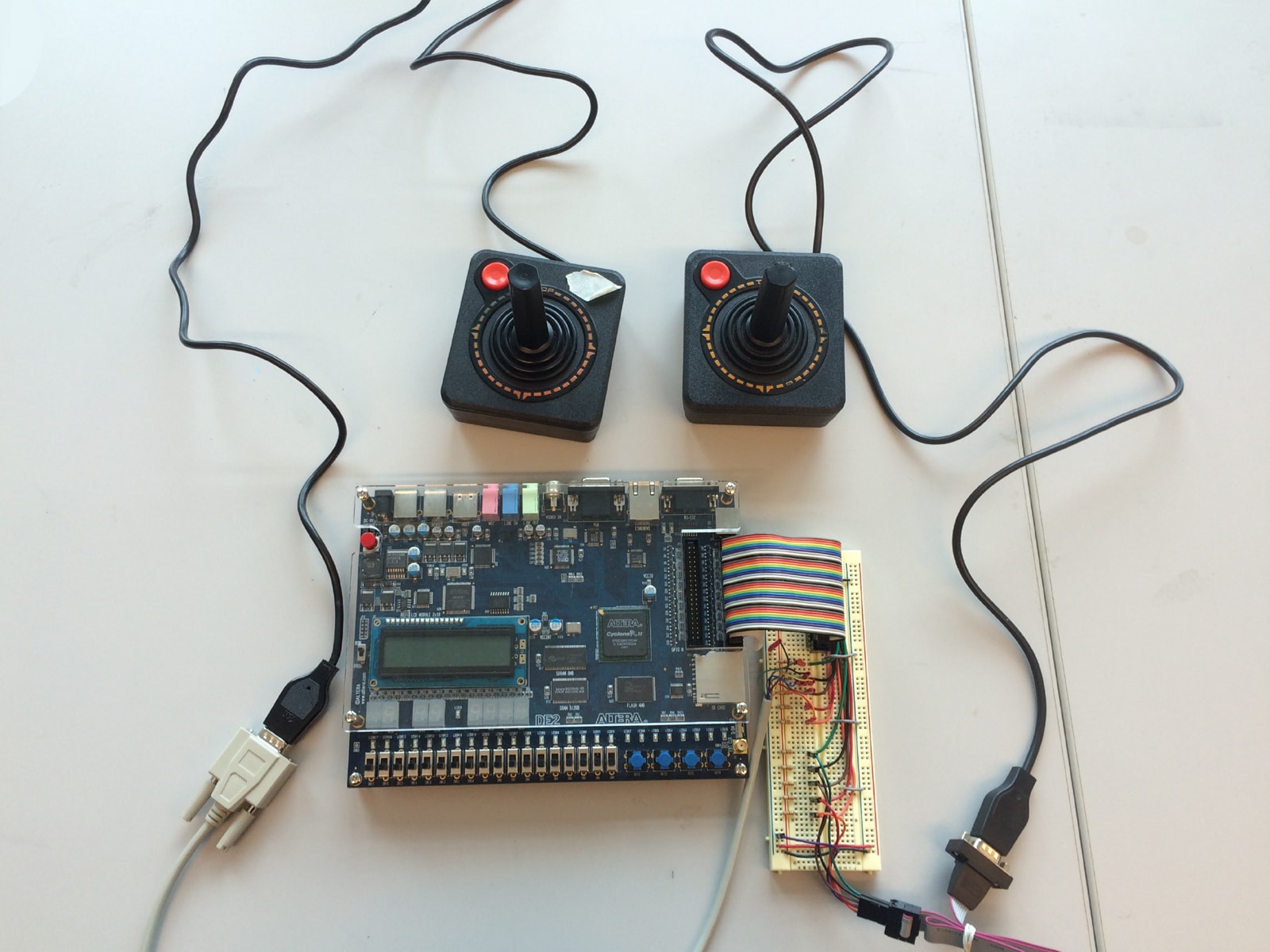 Two Atari joysticks connected to an Altera DE2 board.