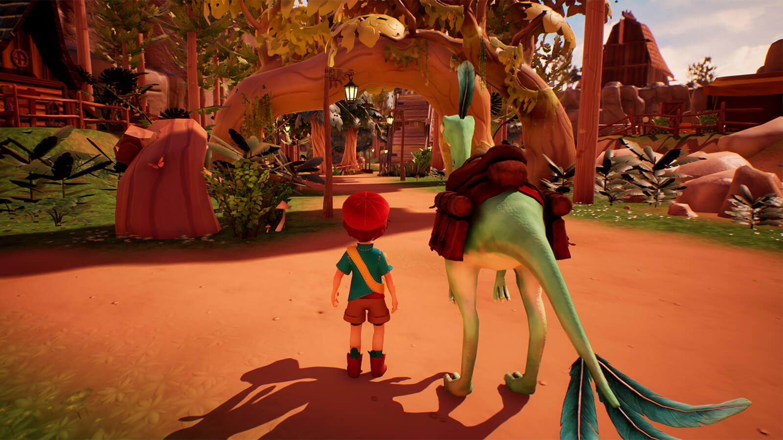 A boy stands next to his saddled-up dinosaur in the town of Cretaceous Cliffs.