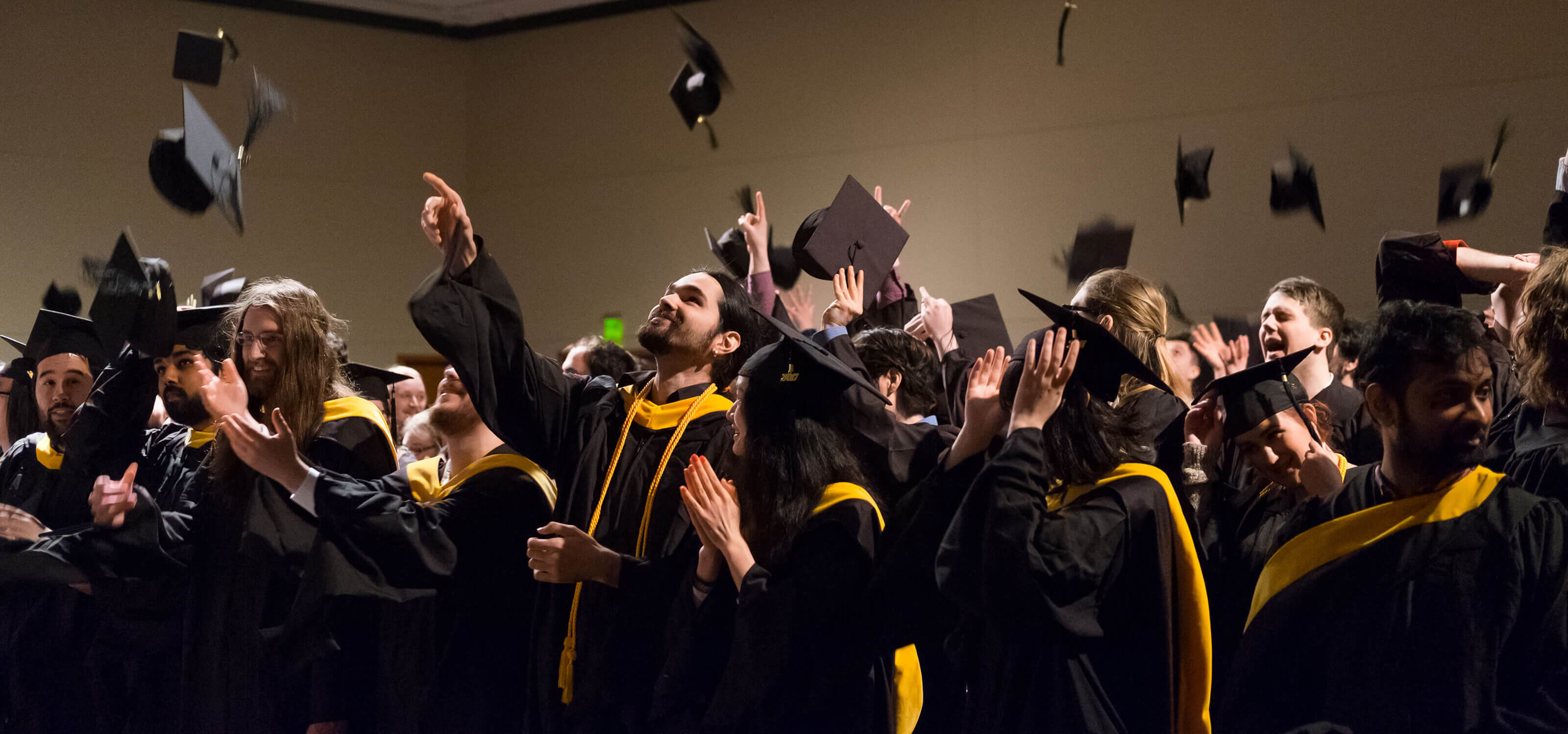 DigiPen 2017 graduates toss their caps in the air