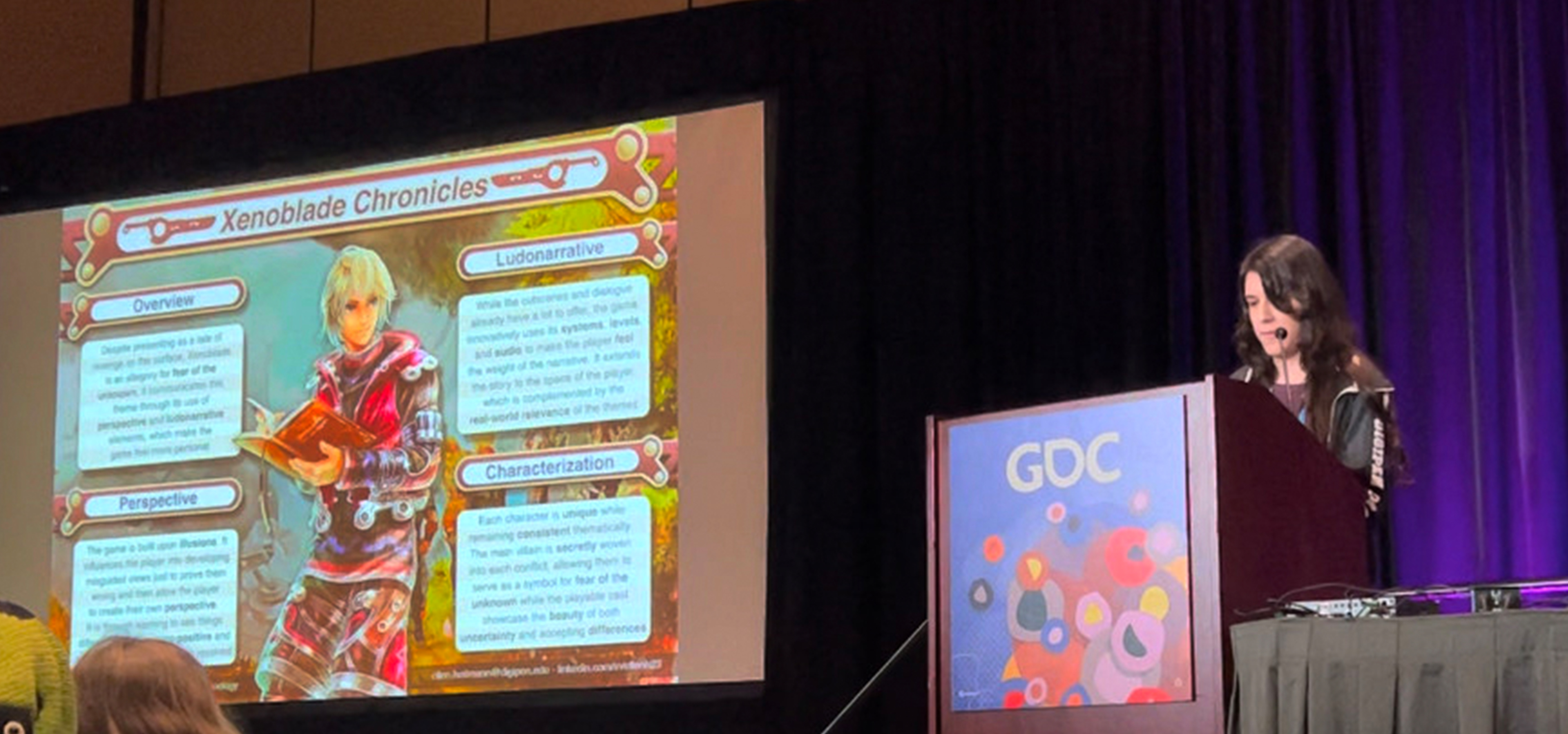 Ellen Heitmann presents her narrative analysis on Xenoblade Chronicles on stage at the GDC Game Narrative Summit.