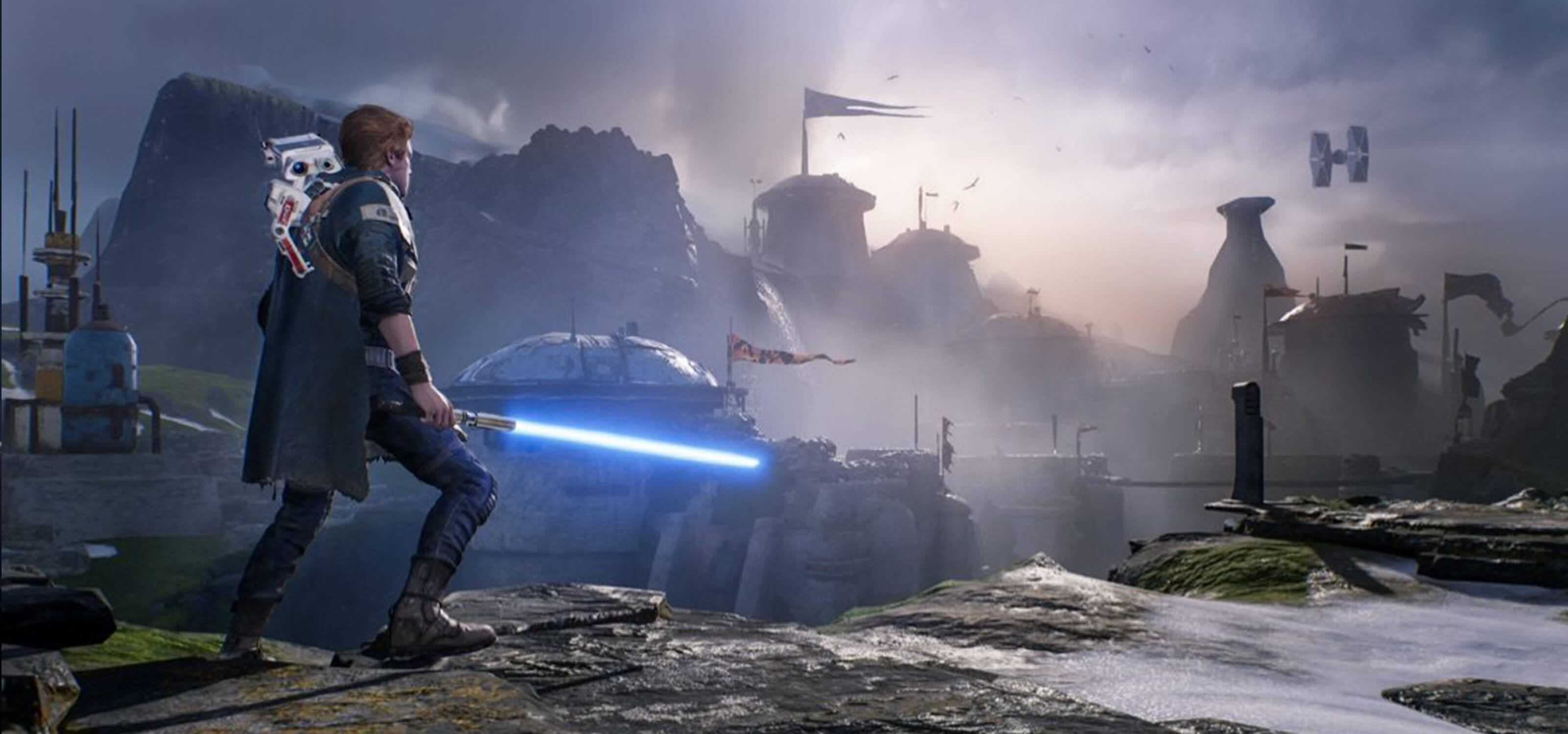 Star Wars Jedi: Fallen Order’s hero, Cal Kestis, wields his lightsaber and looks out at a rocky landscape while a small droid rides on his back.