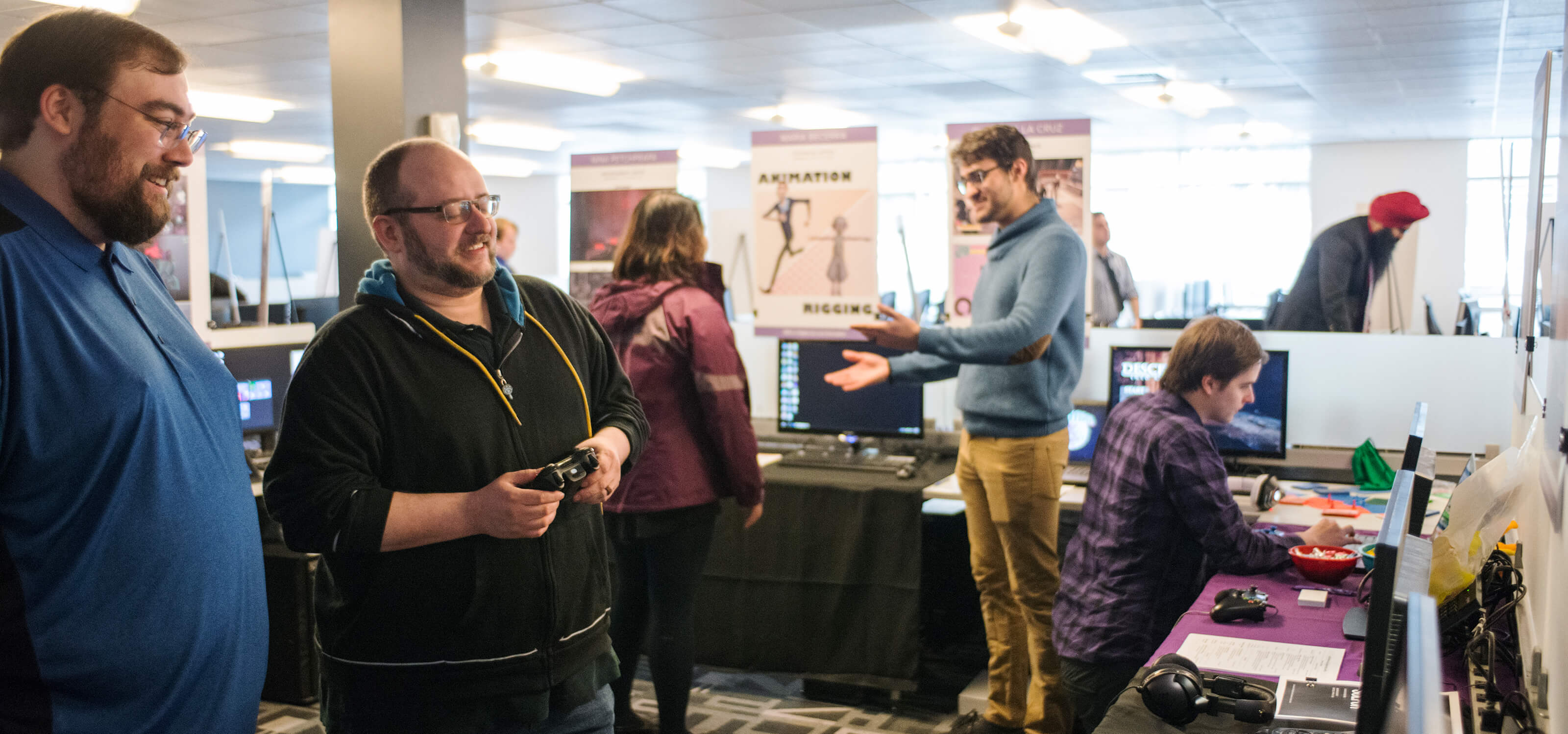 Two employers playing a student game at the 2018 DigiPen Career Fair