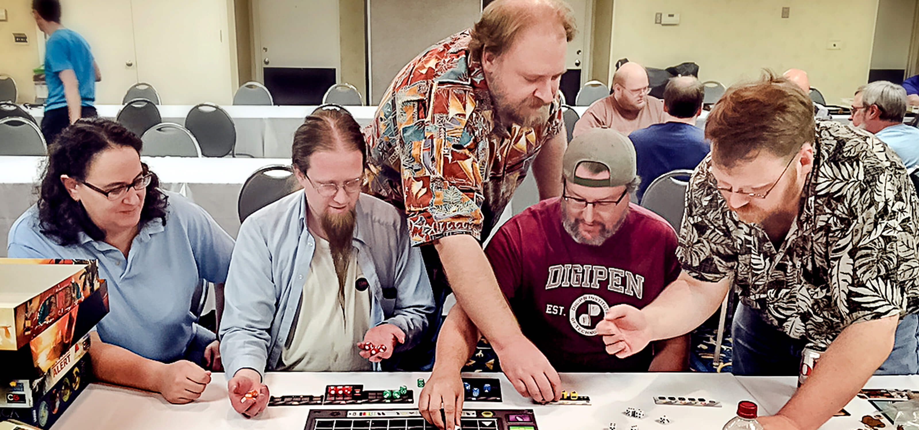 Various DigiPen faculty members playing a board game