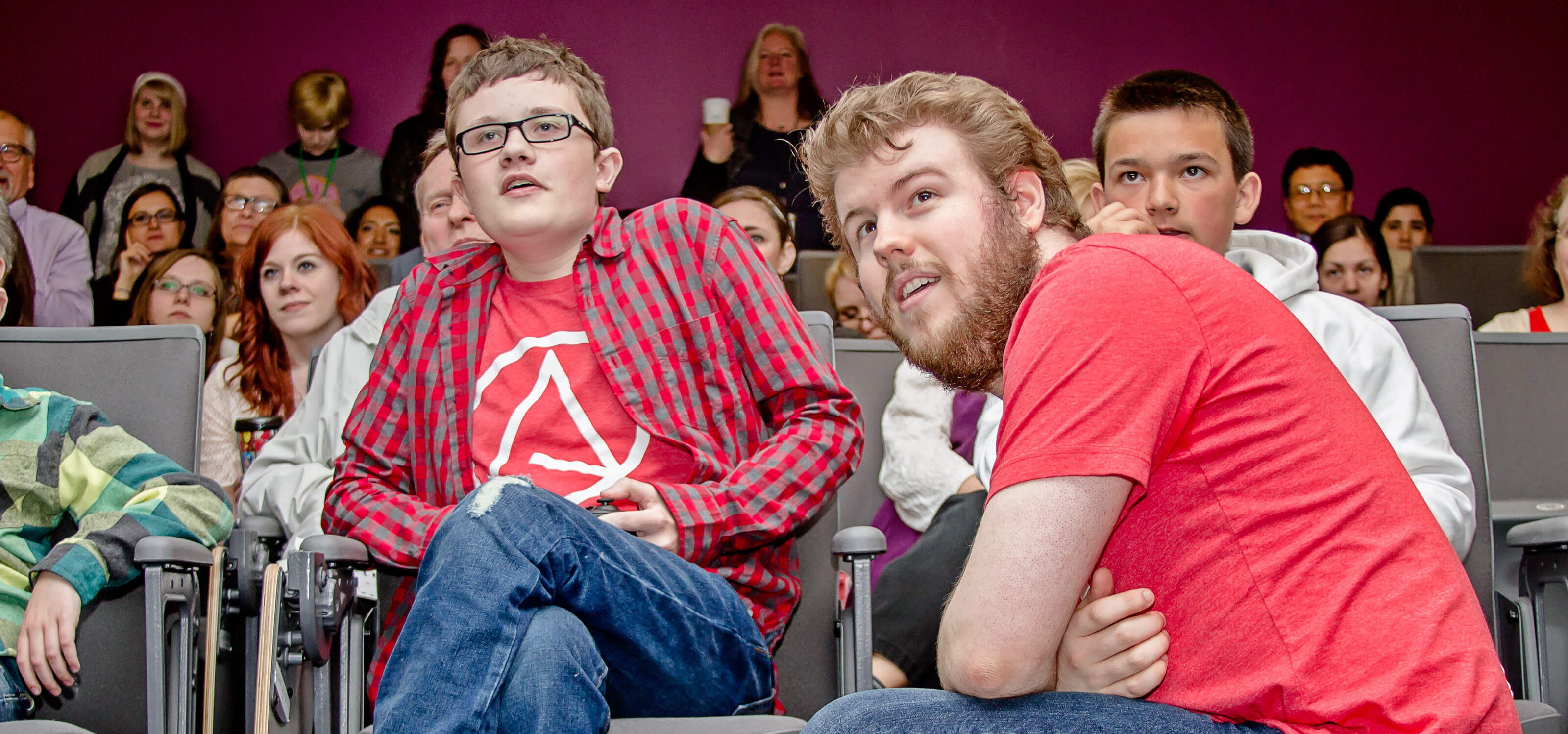 Mason, creator of the Lord of the Bats concept, playing the game as Devin Jensen and audience look on