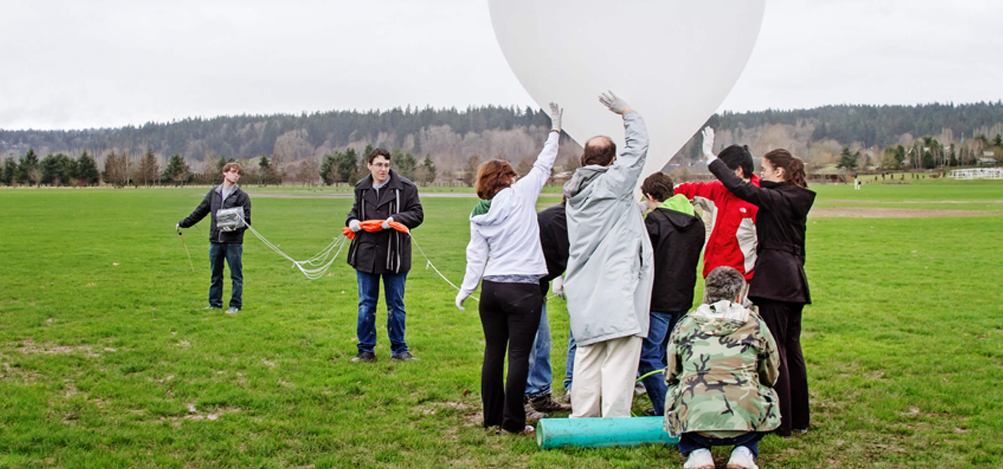 DigiPen students launching a large high-altitude balloon at 60 Acres Park in Redmond