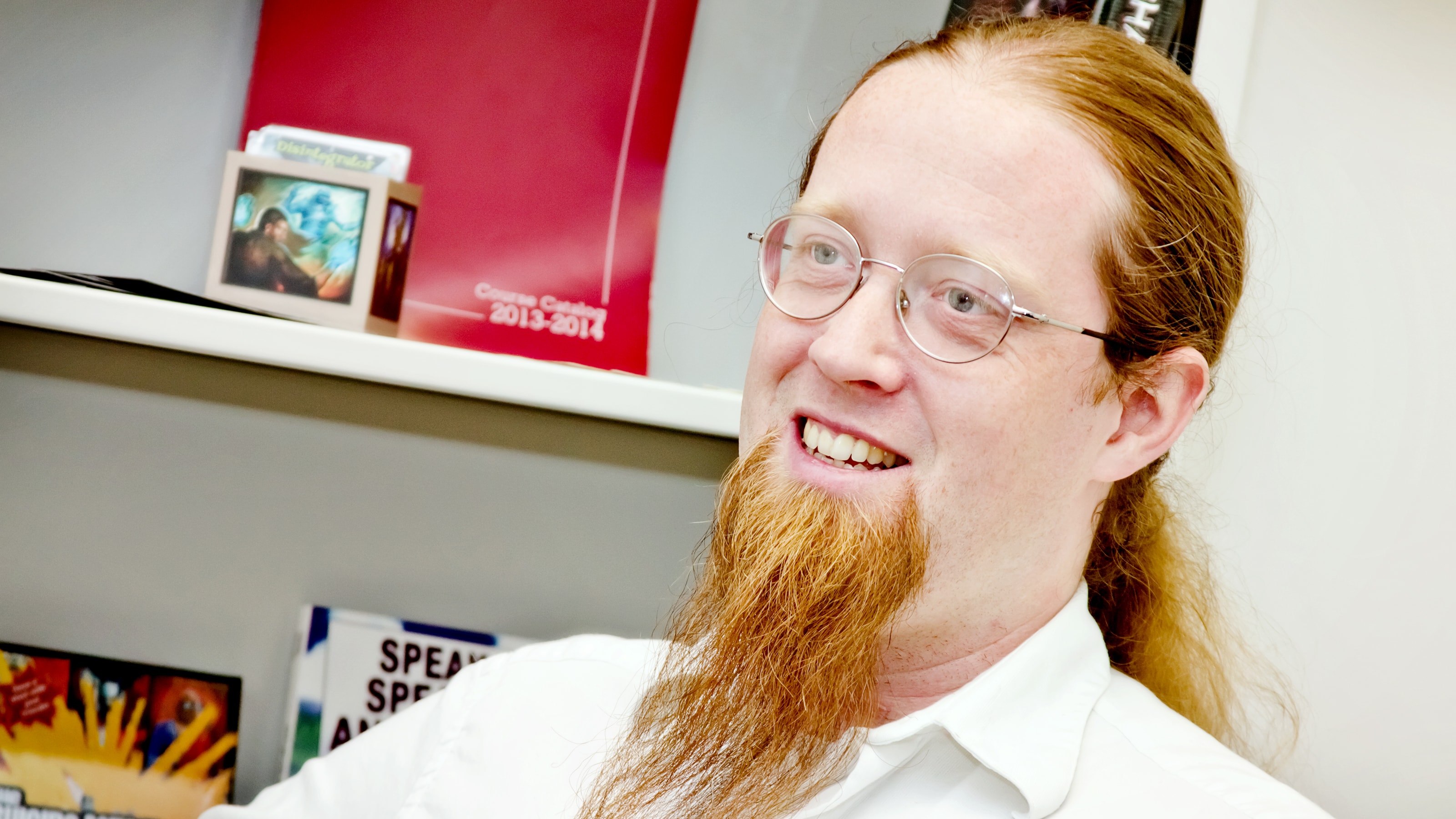 DigiPen game design lecturer Jeremy Holcomb smiling in his DigiPen office