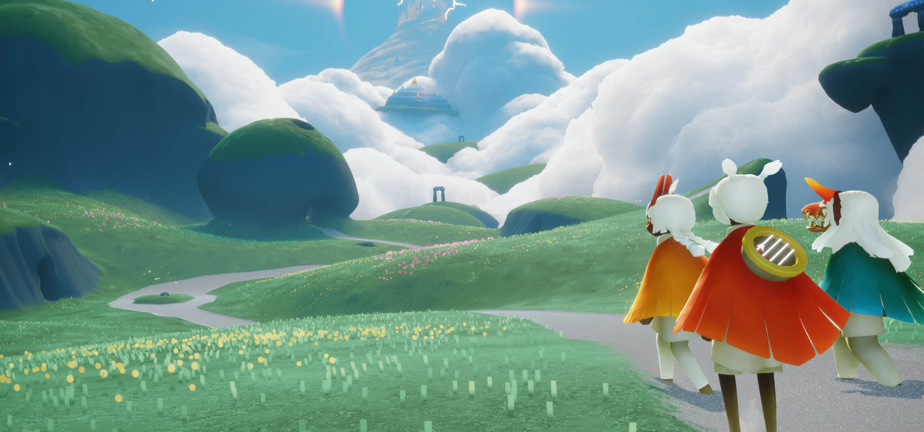 Three characters from Sky: Children of the Light look out at rolling green fields.