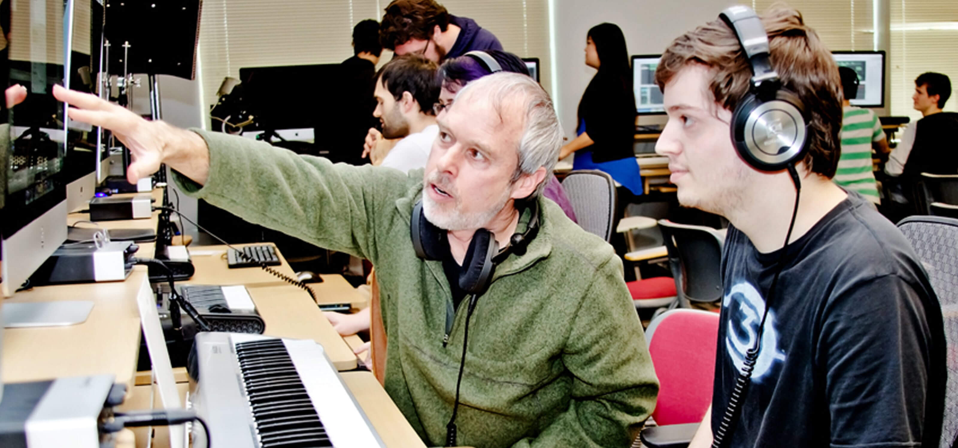 DigiPen music professor Lawrence Schwedler working with a DigiPen student in the new sound lab