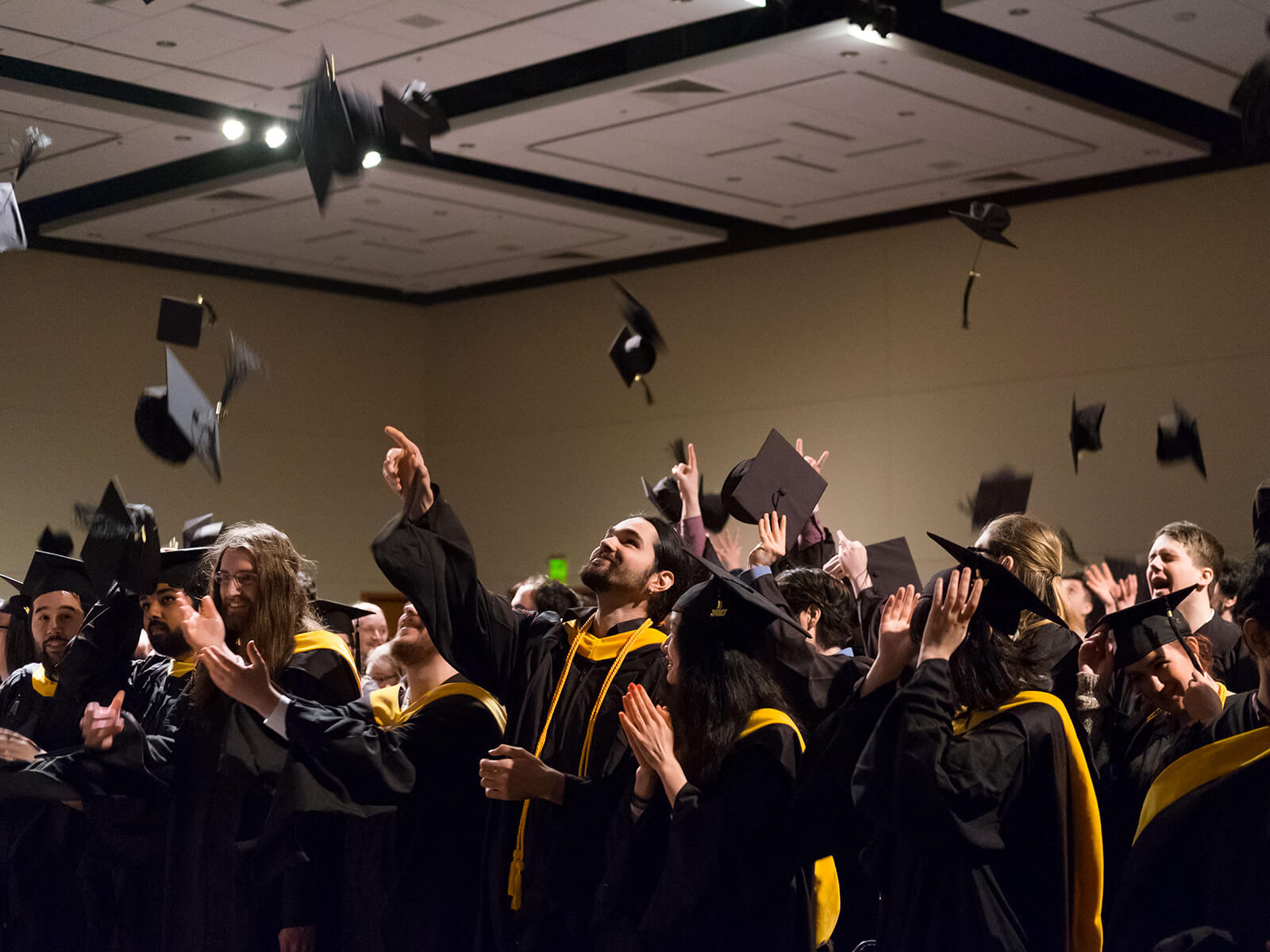 DigiPen 2017 graduates toss their caps in the air