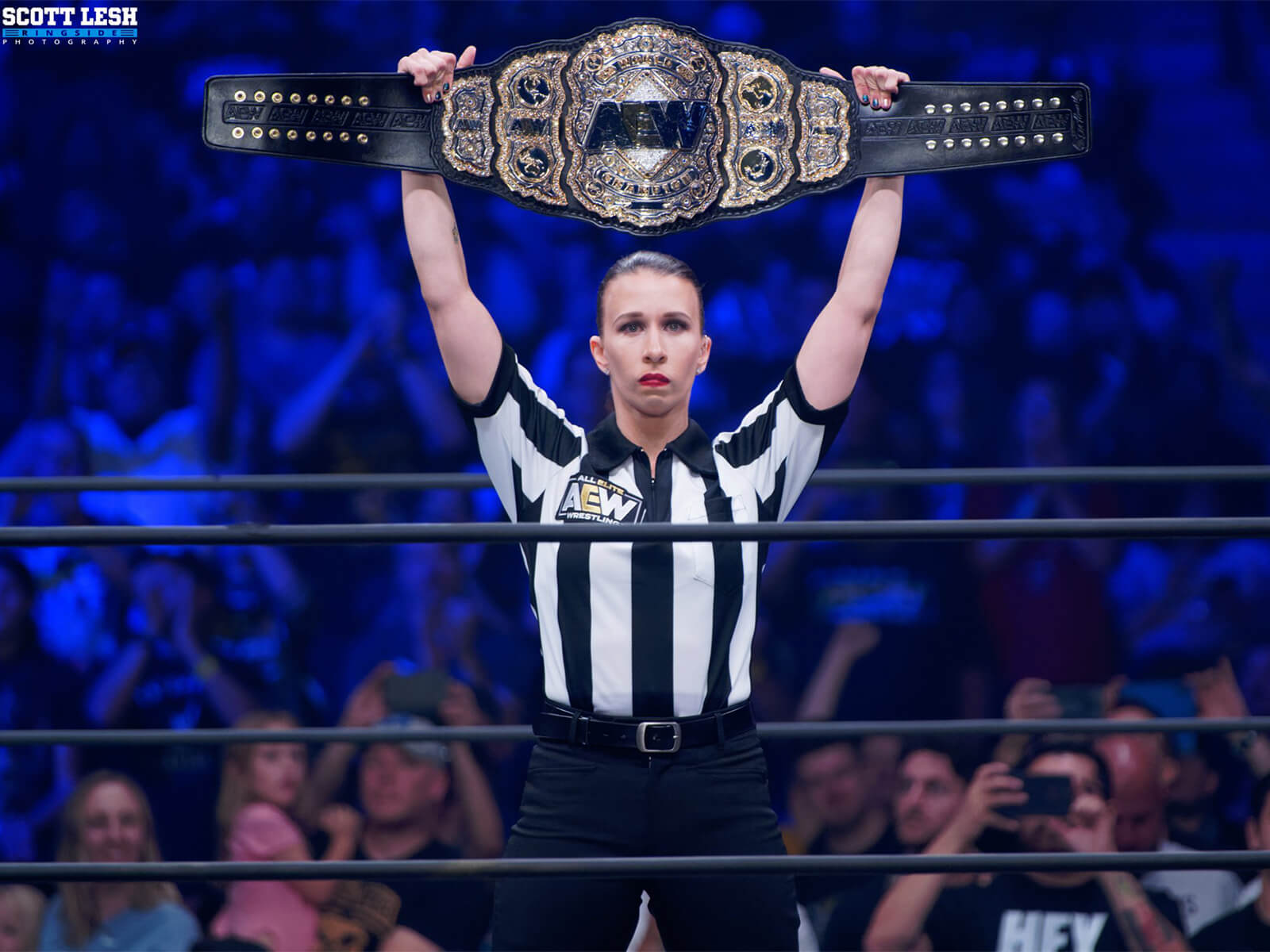 Referee Aubrey Edwards presents the AEW Championship Belt at All Out.