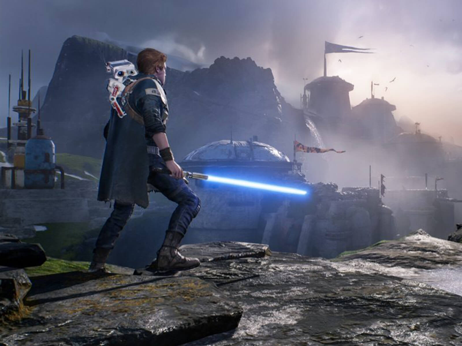 Star Wars Jedi: Fallen Order’s hero, Cal Kestis, wields his lightsaber and looks out at a rocky landscape while a small droid rides on his back.