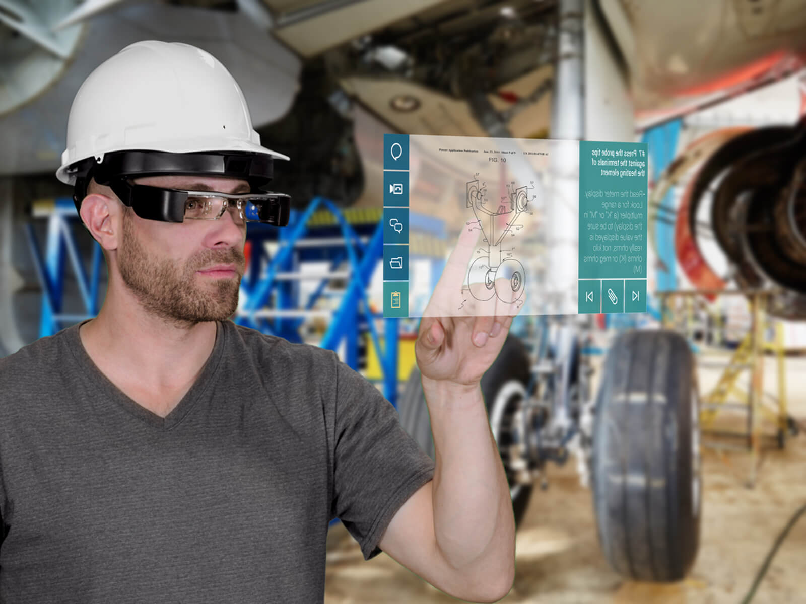 An aerospace engineer wearing a hard hat and Atheer AR's wearable augmented reality glasses interacts with an AR interface displaying schematics of a plane part.