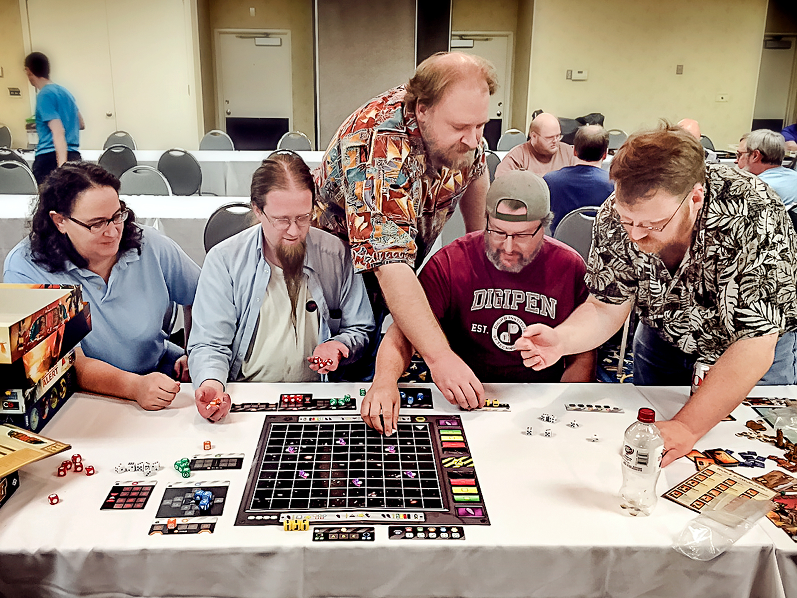 Various DigiPen faculty members playing a board game