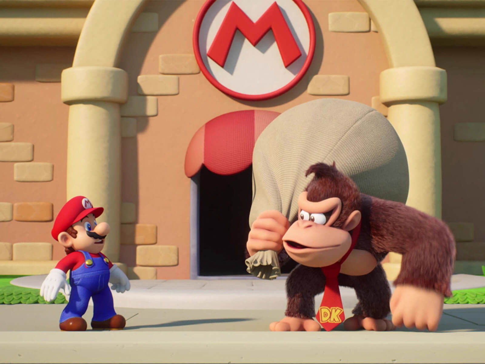 Donkey Kong holds a sack over his shoulder and faces Mario in a screenshot from Mario Vs. Donkey Kong for the Switch.
