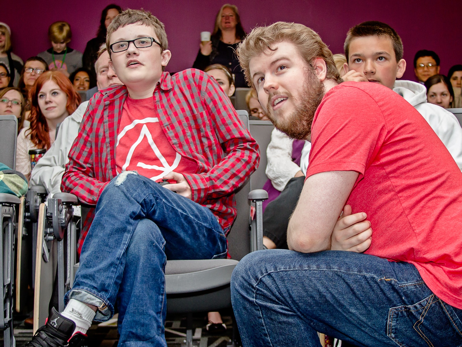 Mason, creator of the Lord of the Bats concept, playing the game as Devin Jensen and audience look on