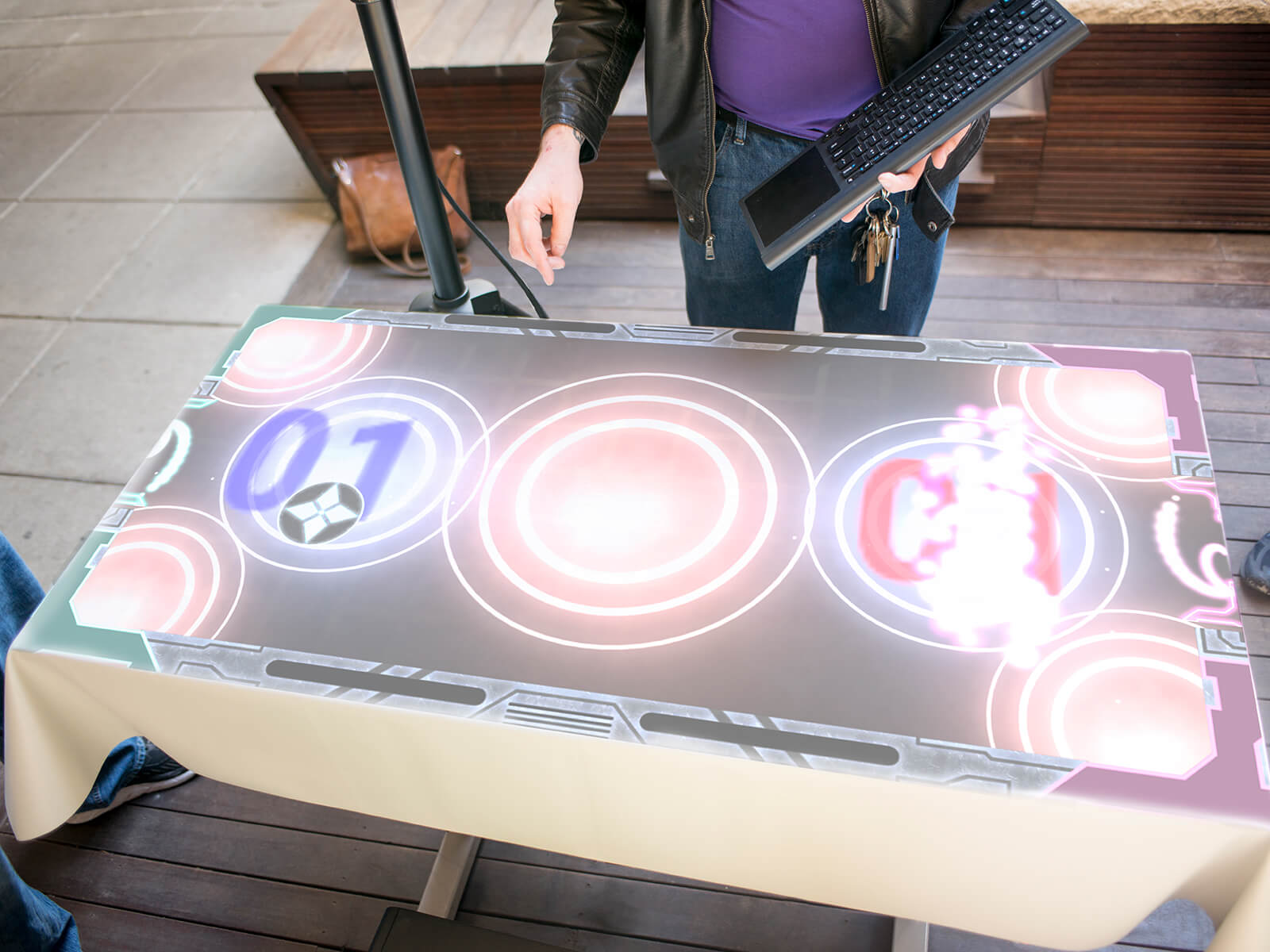 Overhead view of the Striker Air Hockey table with the game projected onto it