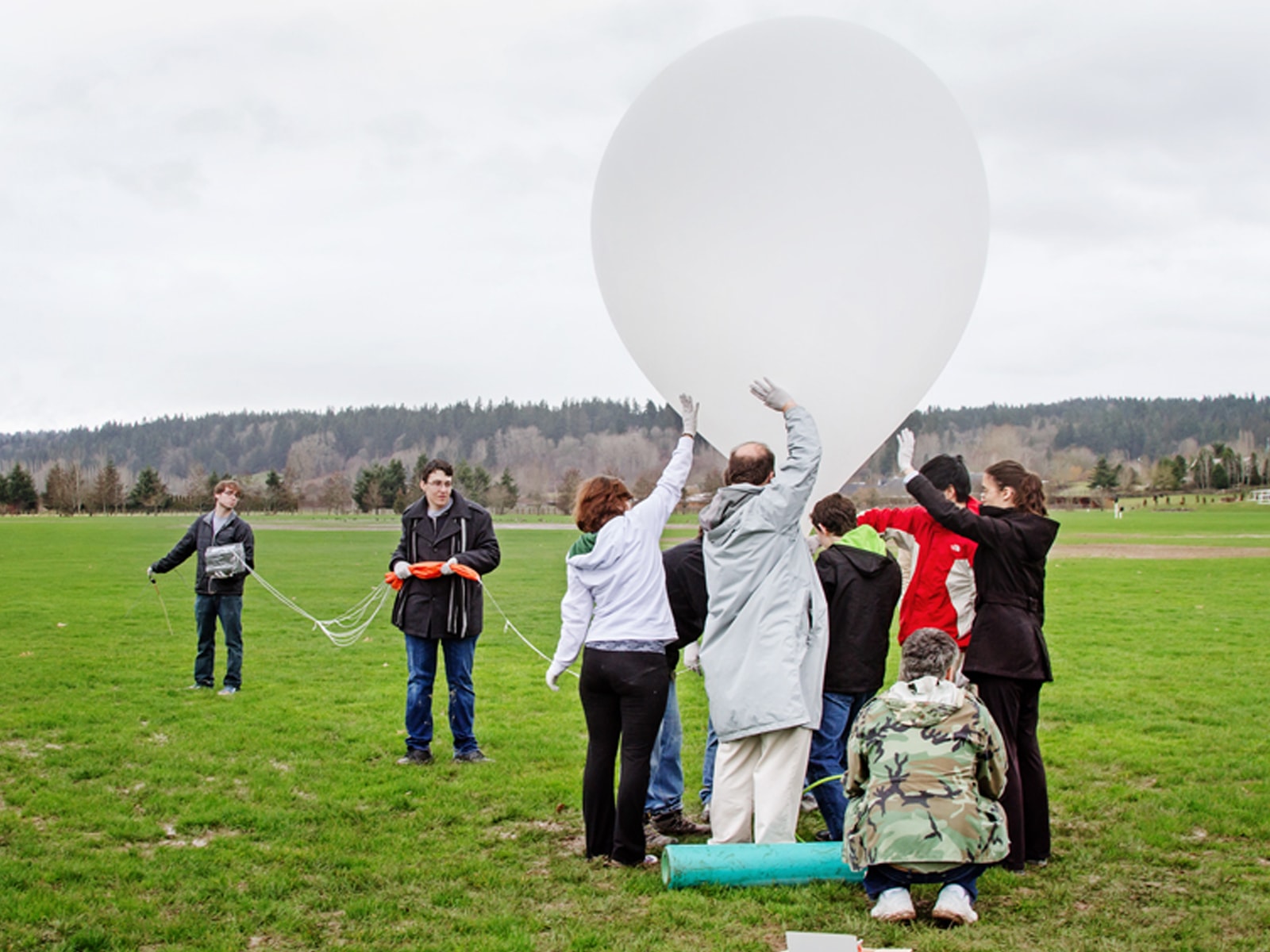 DigiPen students launching a large high-altitude balloon at 60 Acres Park in Redmond