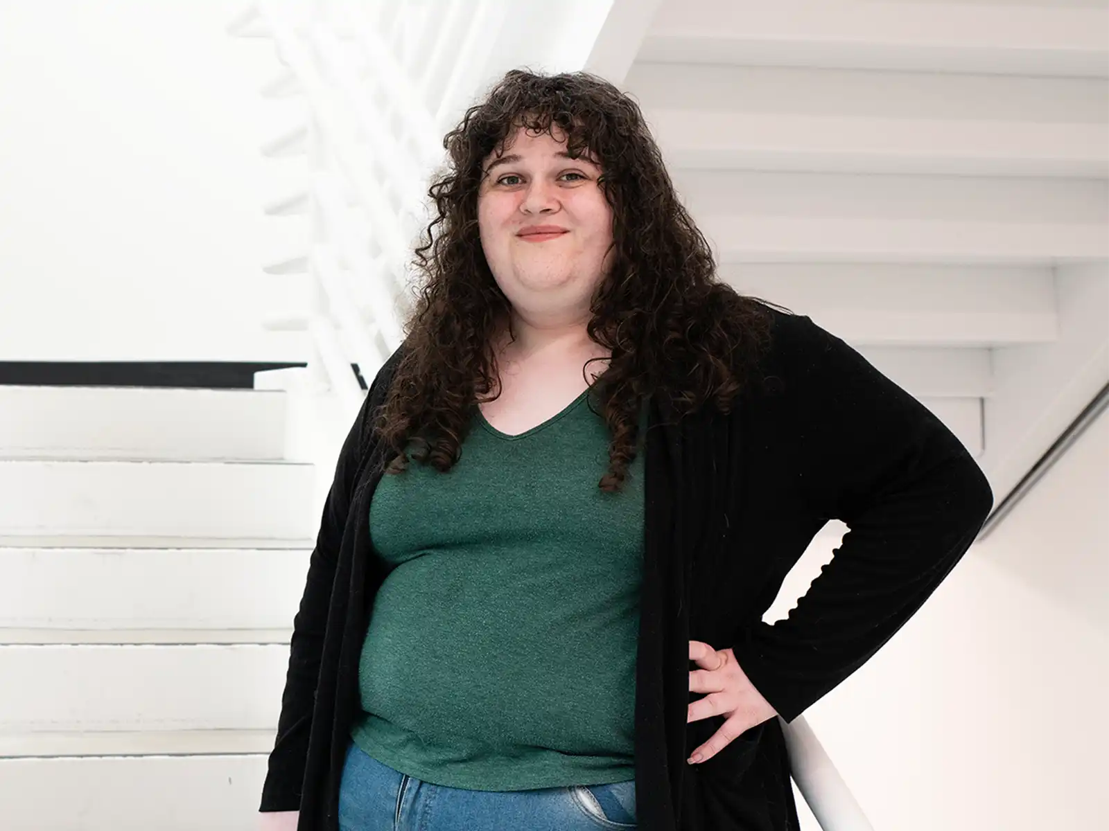 Kiera Williams smiles in a DigiPen campus stairwell.