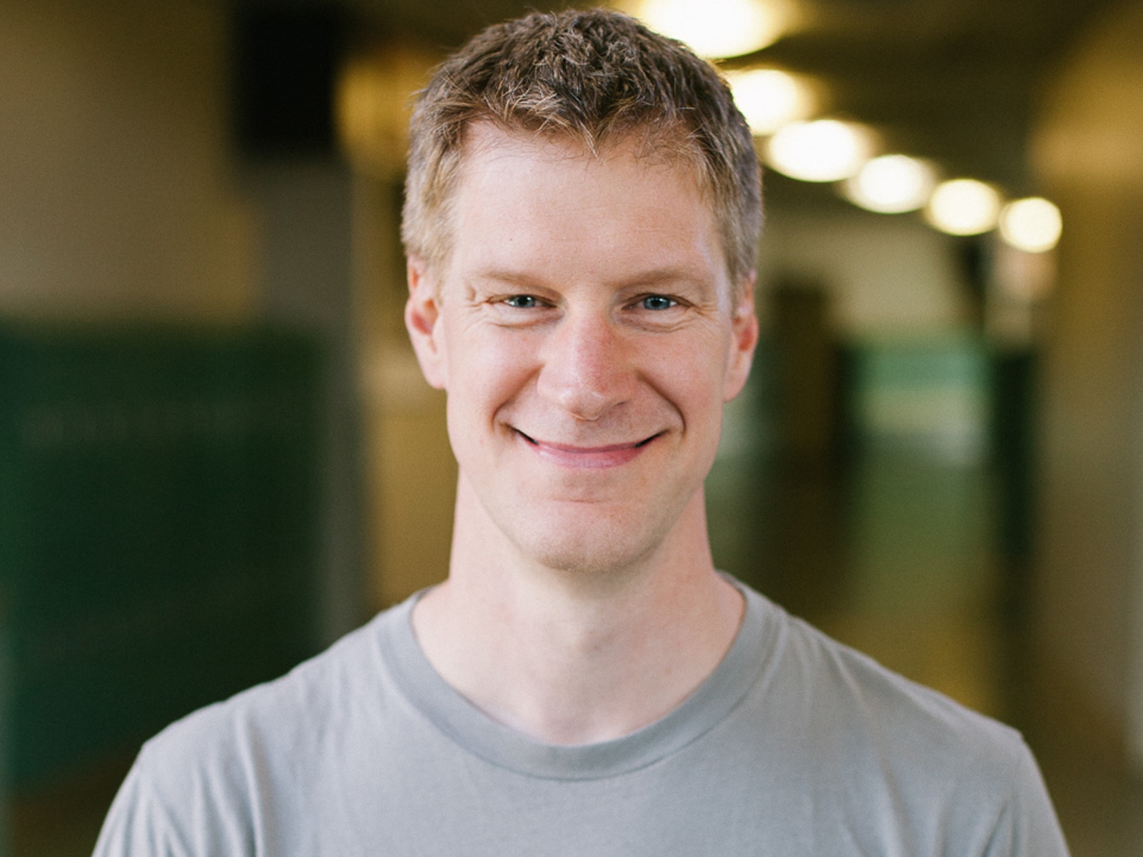 DigiPen Dean of Faculty Erik Mohrmann smiling in a campus hallway